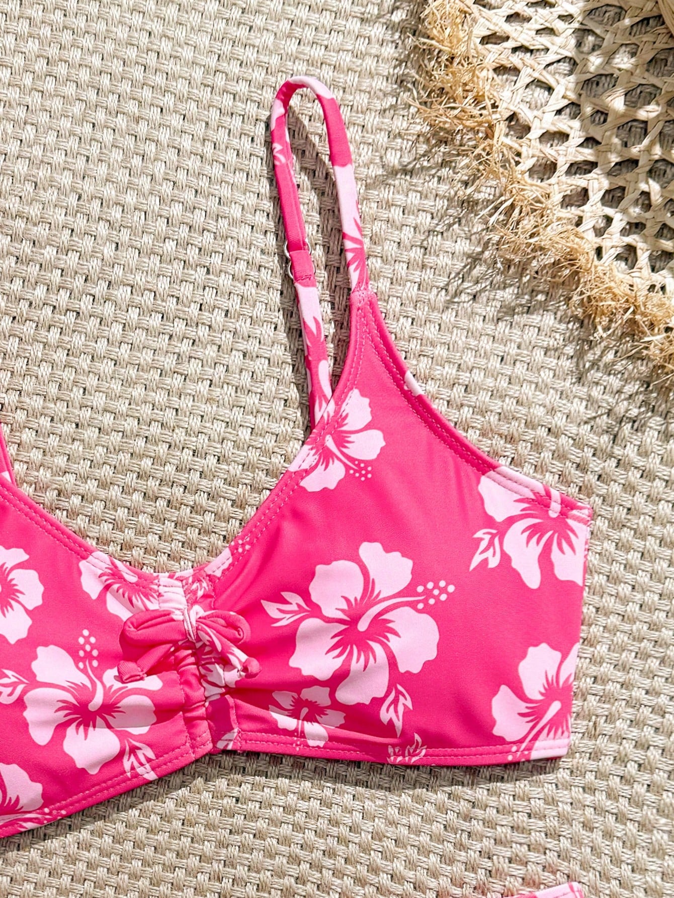 Tween girls 2-piece ditsy floral bikini set featuring a spaghetti strap top with center string detail and matching bottoms with side strings, designed for swimming, vacation, and summer wear.