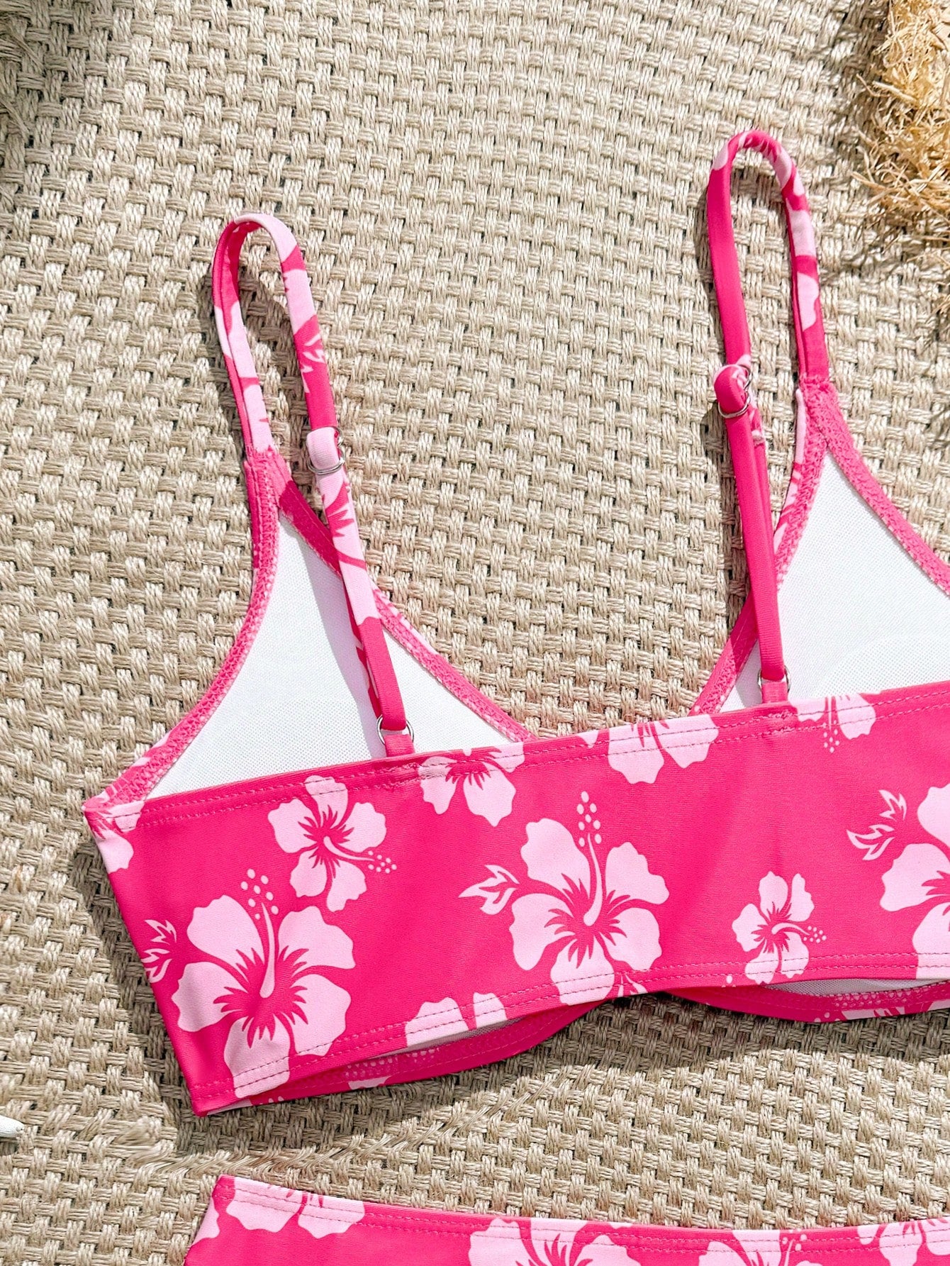 Tween girls 2-piece ditsy floral bikini set featuring a spaghetti strap top with center string detail and matching bottoms with side strings, designed for swimming, vacation, and summer wear.