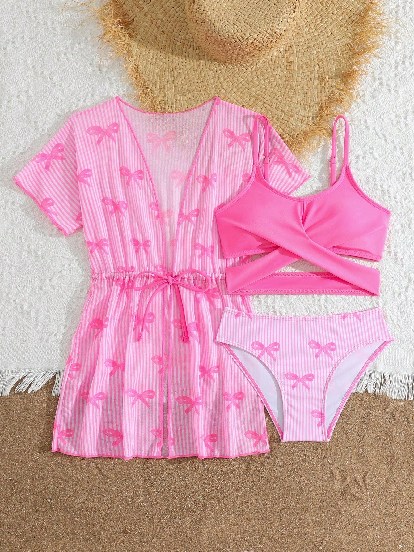 Three-piece tween girls swimwear set with a floral print, featuring a criss-cross bikini top, regular bikini bottoms, and a kimono cover-up in assorted prints.