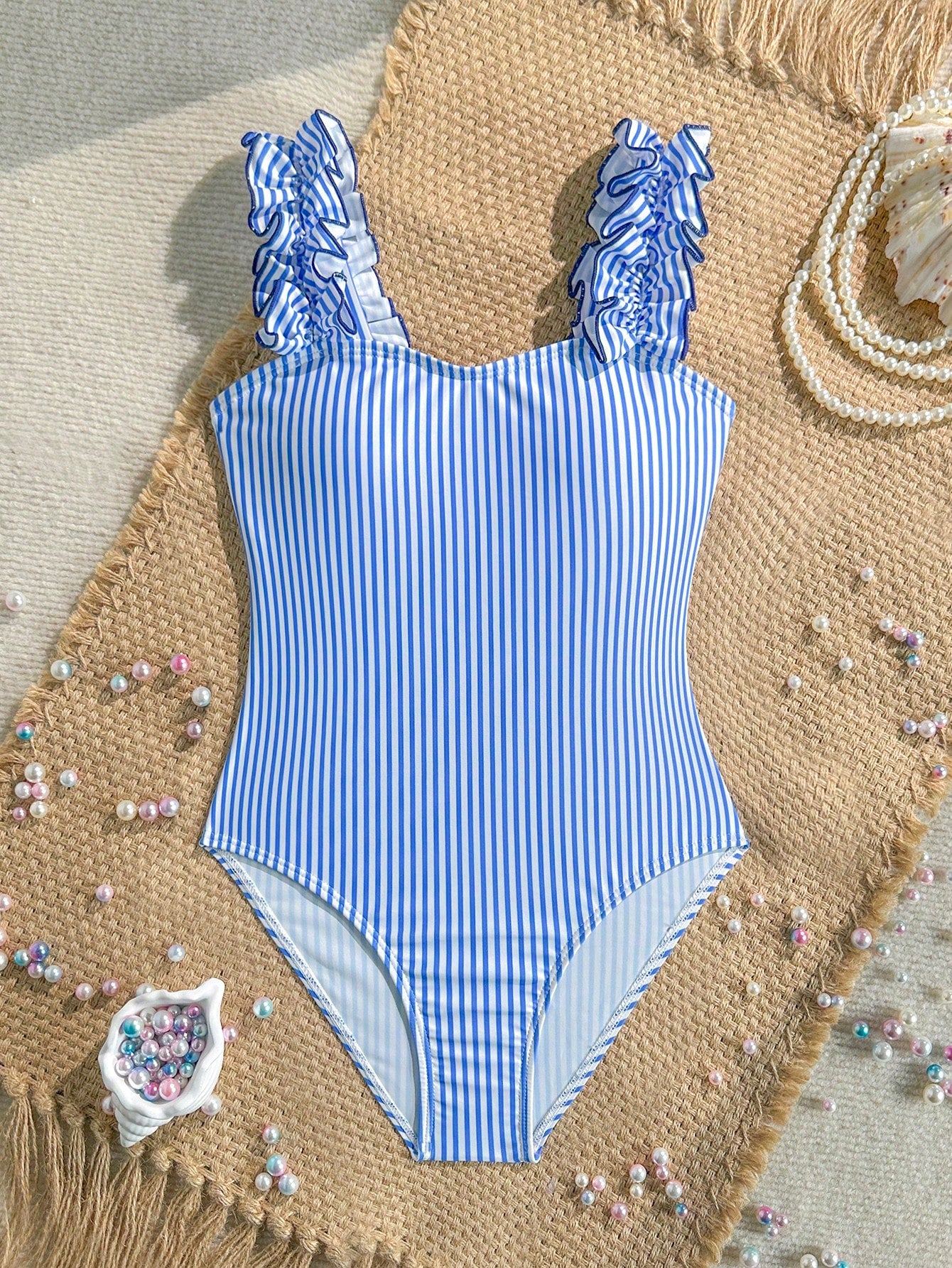 Tween girls one-piece swimsuit with 3D floral applique details, plant graphics, scoop neck, fitted shape, and lined body for beach and vacation wear.