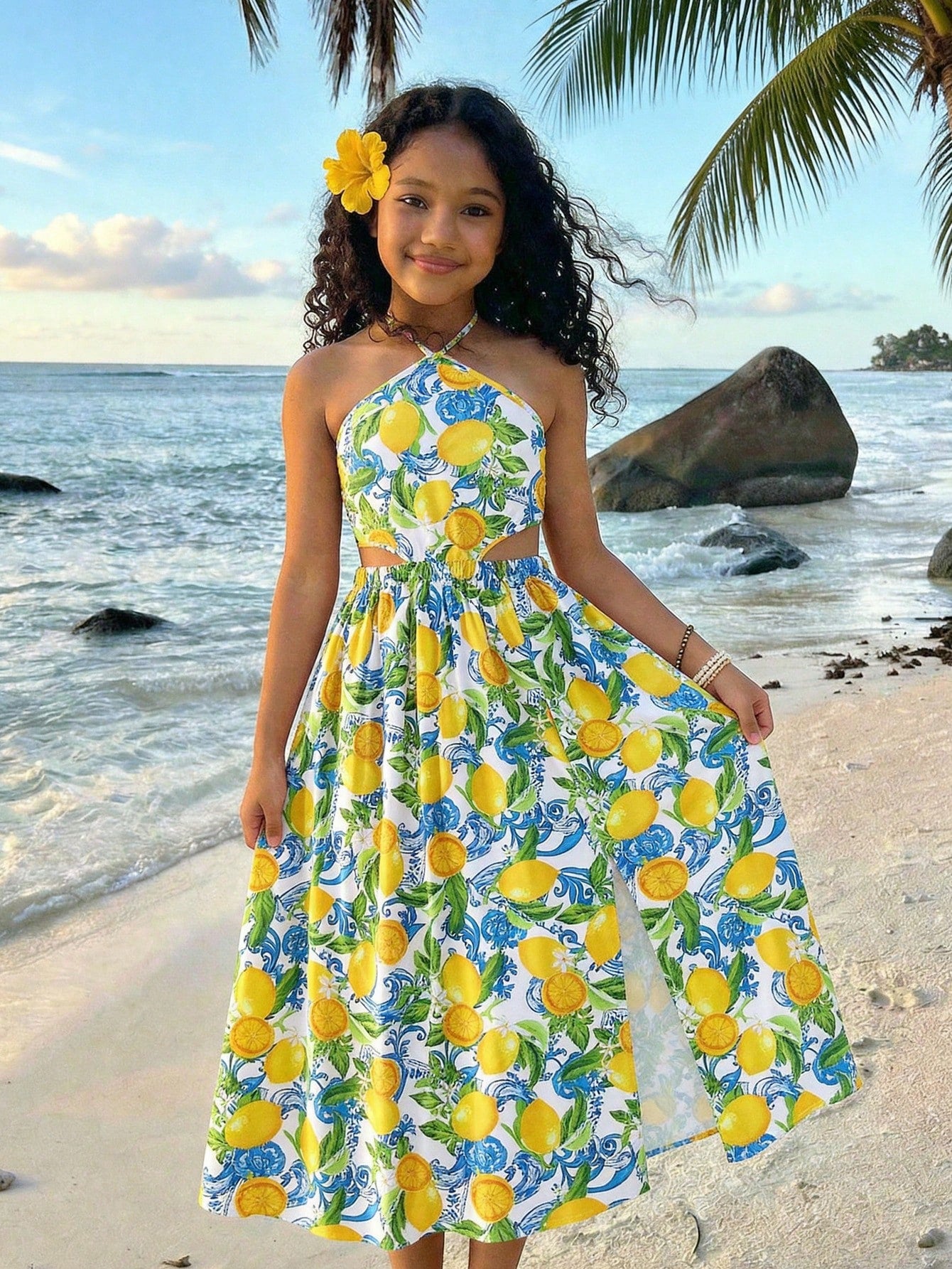 Tween girls floral halter dress with backless sleeveless design, belted high waist, shirred details, appliques, and flared A-line midi silhouette for summer vacation or graduation outfit.