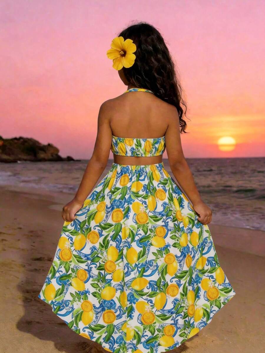 Tween girls floral halter dress with backless sleeveless design, belted high waist, shirred details, appliques, and flared A-line midi silhouette for summer vacation or graduation outfit.