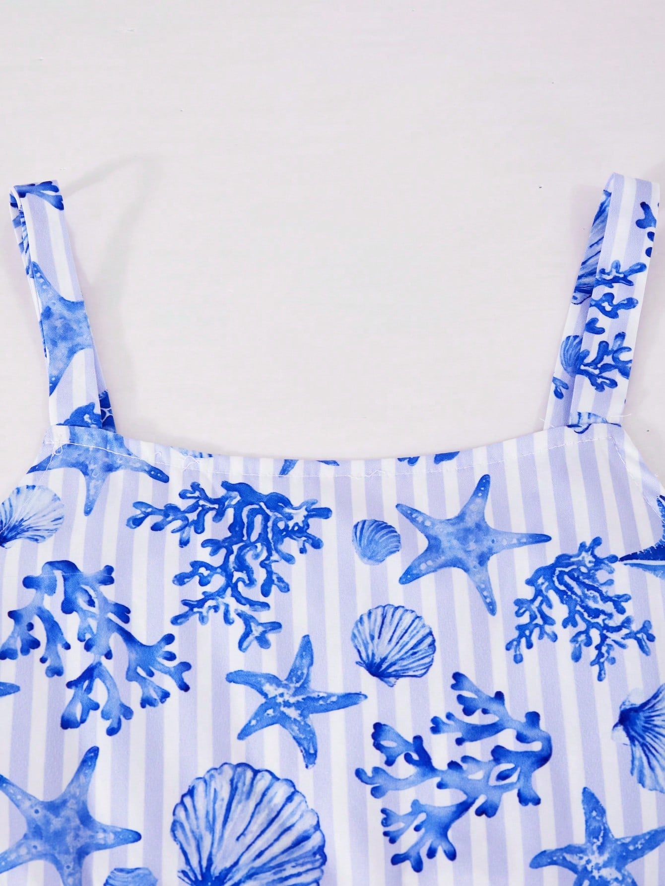 Girls spaghetti strap A-line midi dress with floral and marine-inspired vacation print, lace trim, high waist, and flared hem