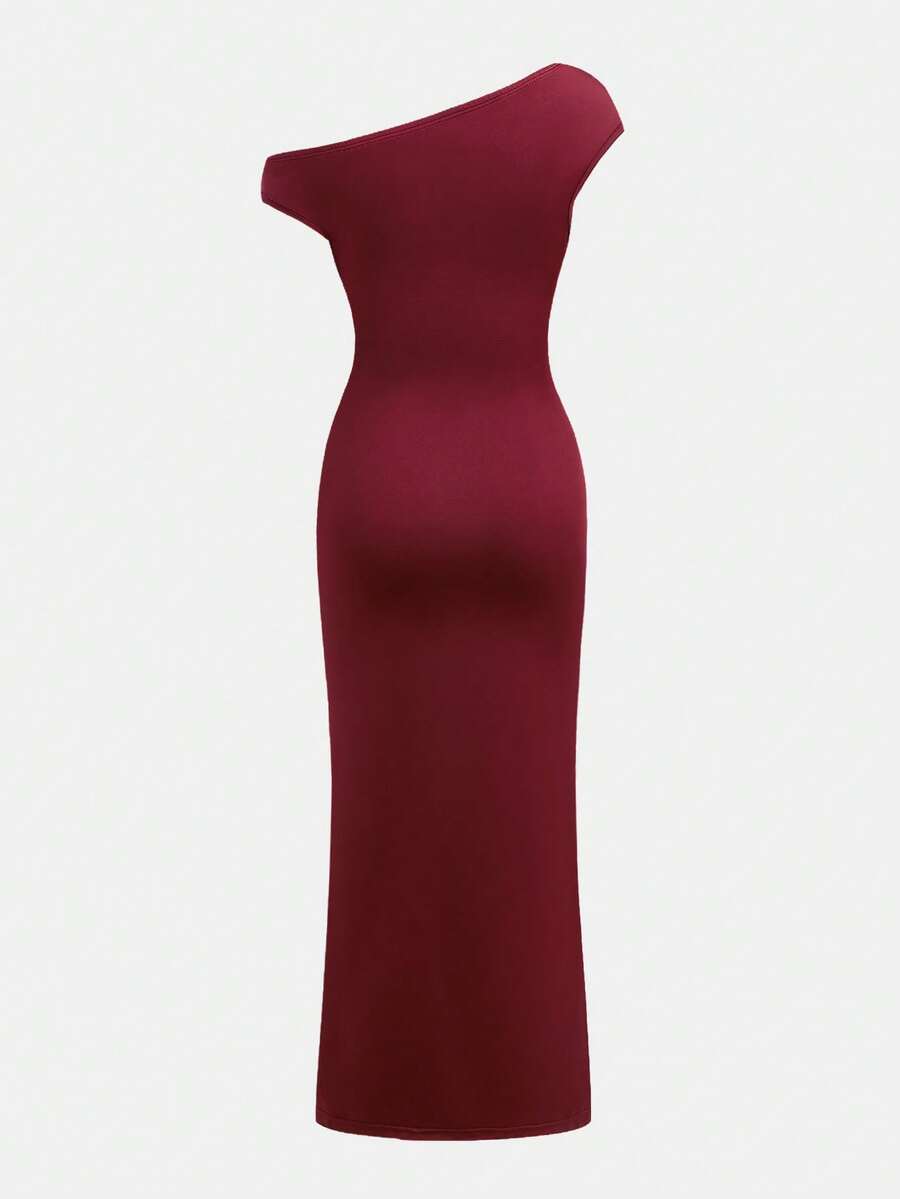 Tween girl wearing an elegant burgundy asymmetric bodycon long dress featuring 3D floral decoration, split pencil hem, and short sleeves.