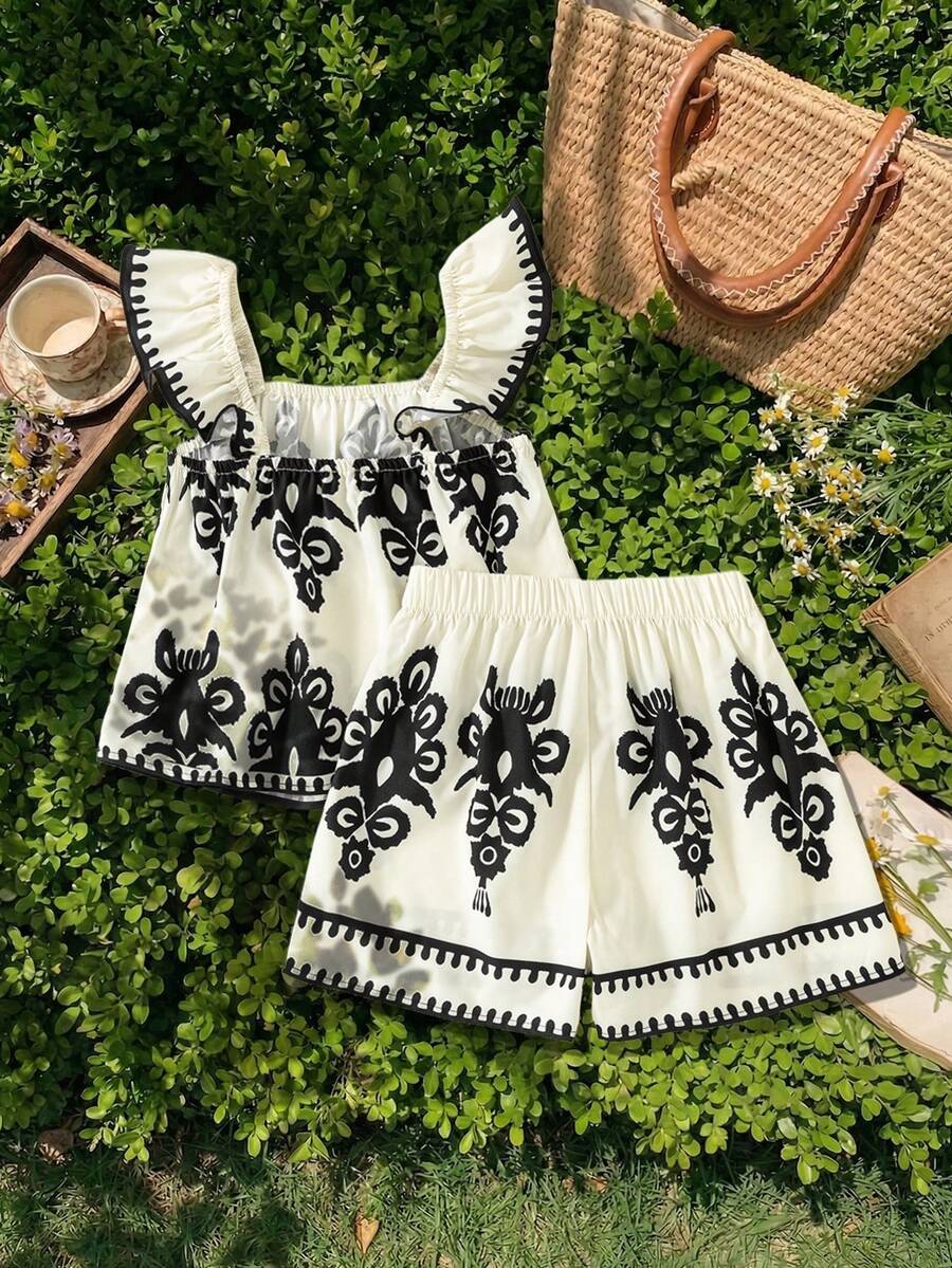Tween girls 2-piece bohemian outfit set in apricot featuring a square neck embroidered sleeveless camisole top and matching floral wide leg shorts.