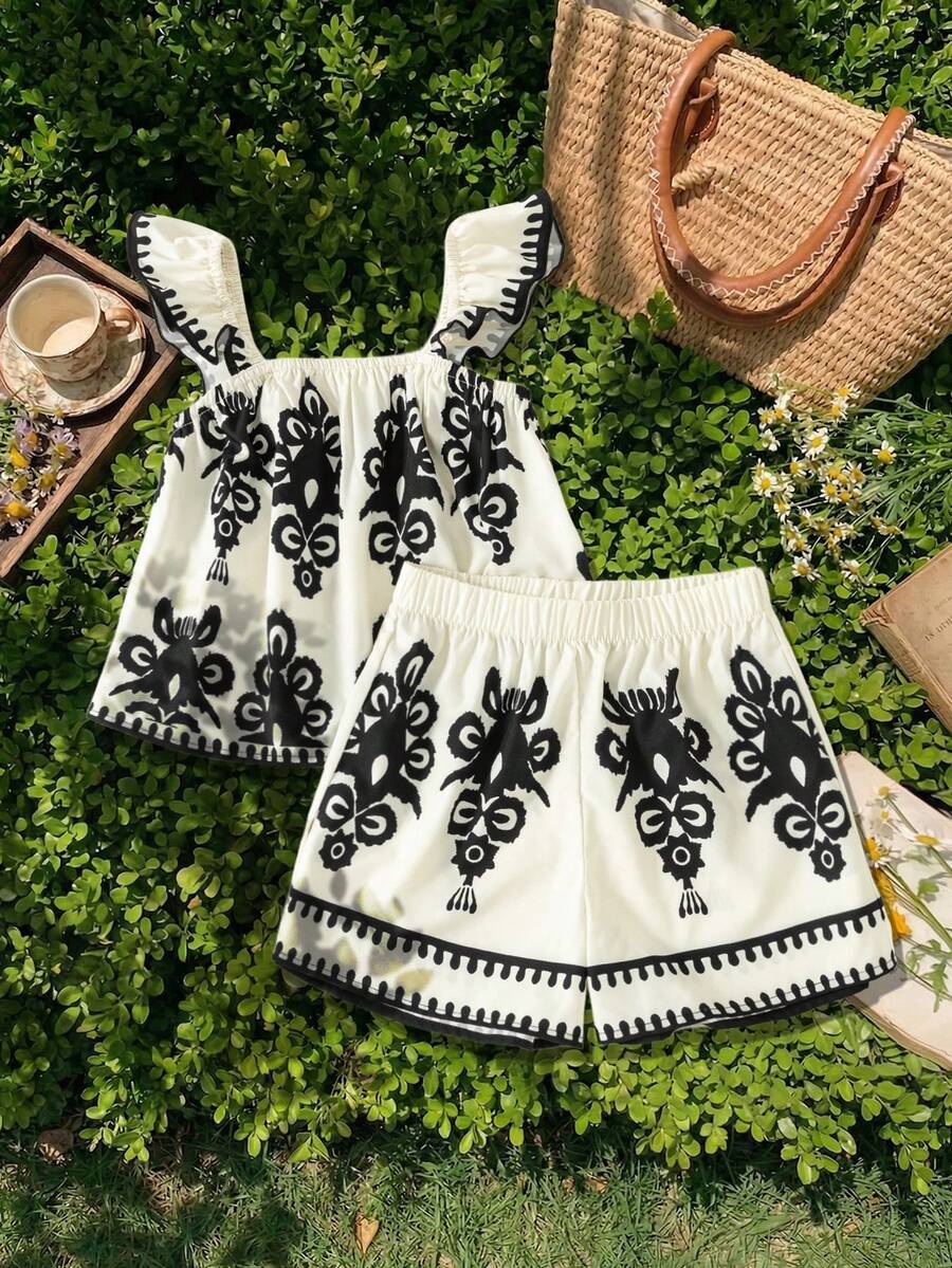 Tween girls 2-piece bohemian outfit set in apricot featuring a square neck embroidered sleeveless camisole top and matching floral wide leg shorts.