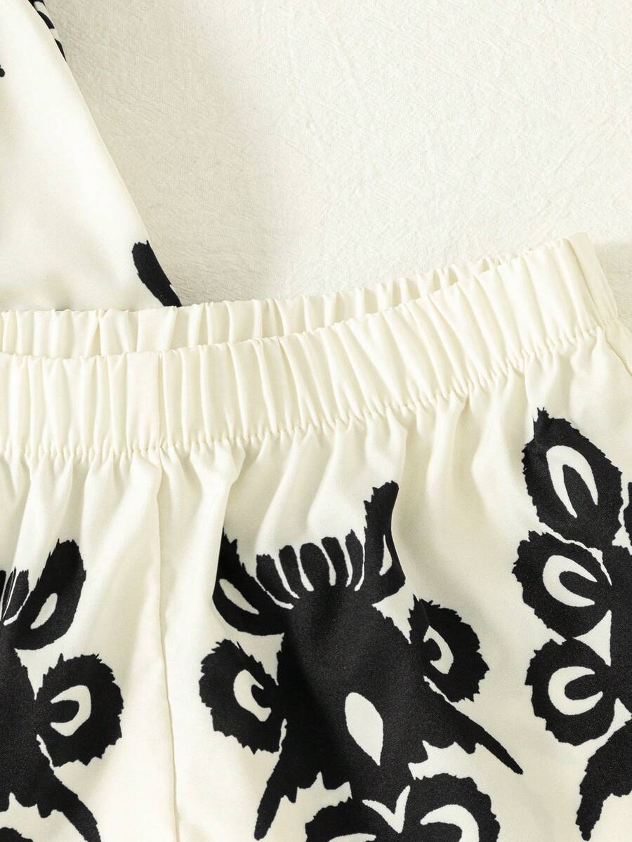 Tween girls 2-piece bohemian outfit set in apricot featuring a square neck embroidered sleeveless camisole top and matching floral wide leg shorts.