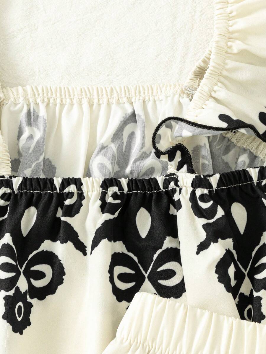 Tween girls 2-piece bohemian outfit set in apricot featuring a square neck embroidered sleeveless camisole top and matching floral wide leg shorts.