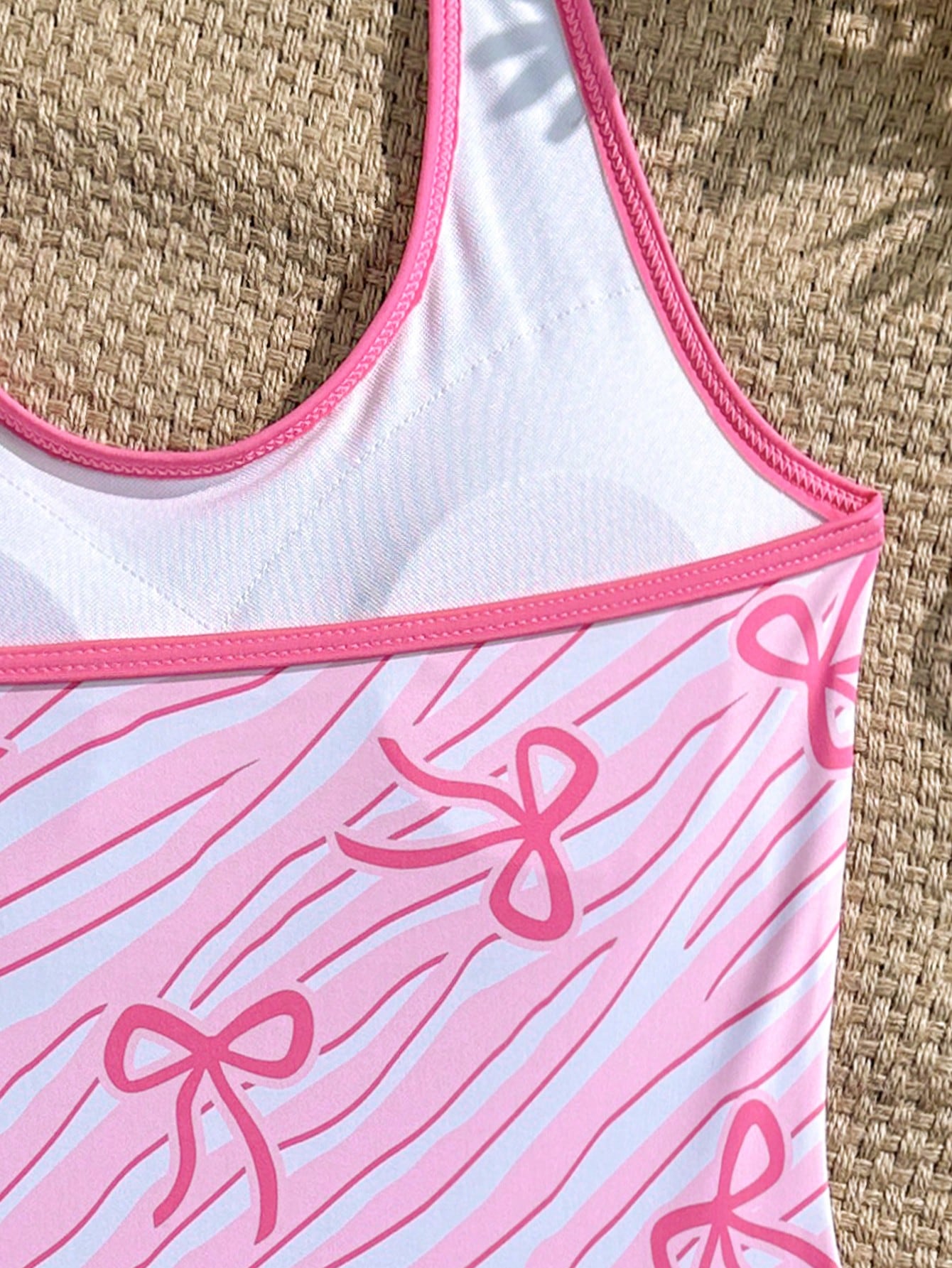 Girls 2-piece swimwear set featuring a butterfly print halter swimsuit top with contrast piping and separate mid-waist shorts; sleeveless, high-stretch, wireless design for beach and vacation wear.