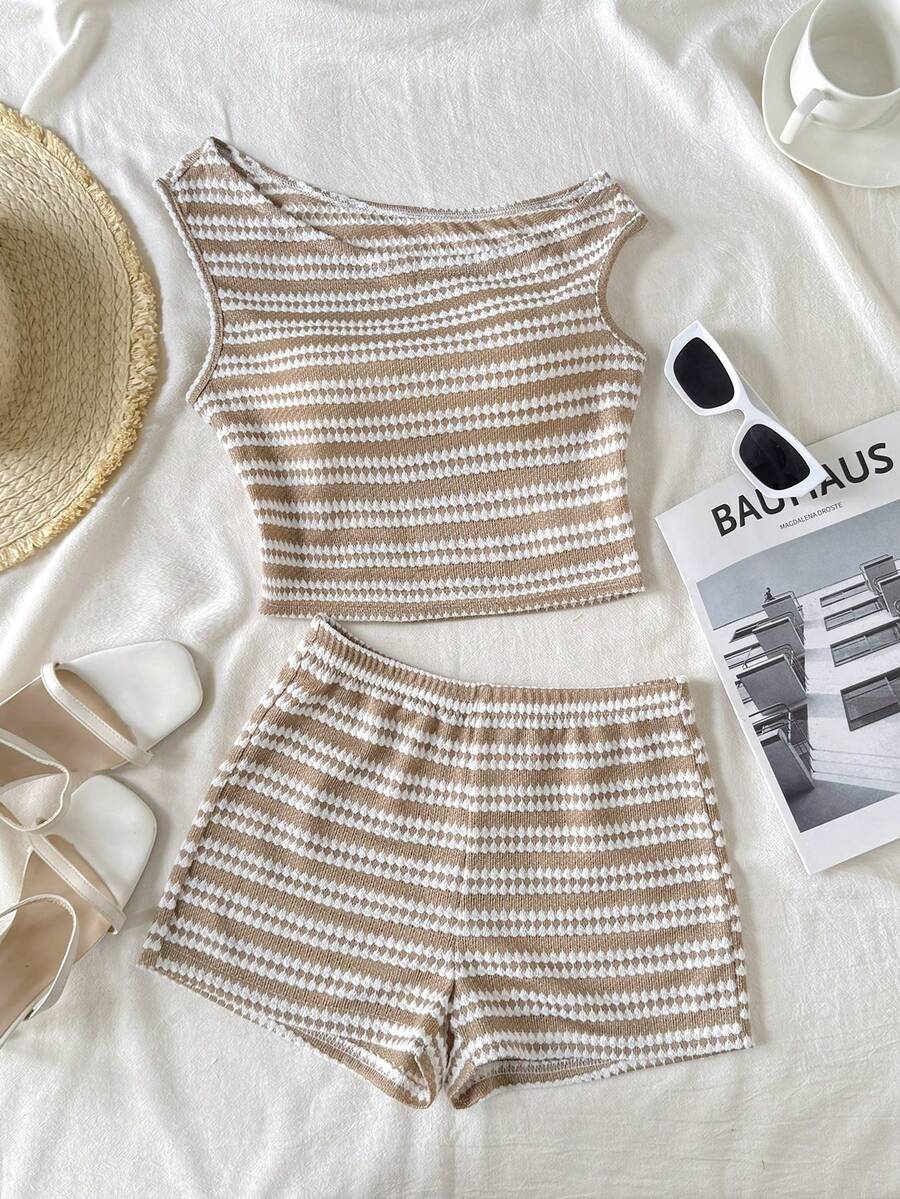Tween girls 2-piece summer clothing set featuring a black asymmetric rib-knit striped off-shoulder t-shirt and matching slim fit shorts.