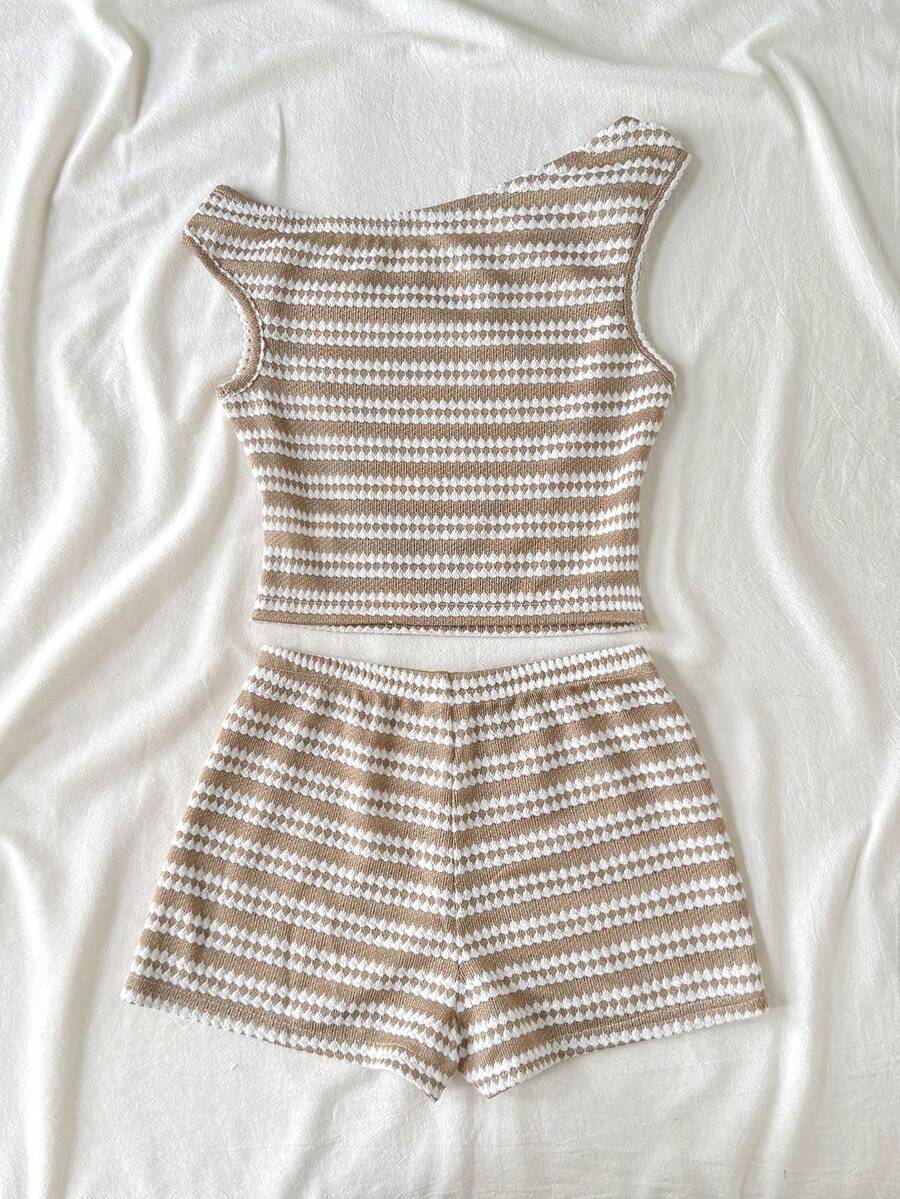 Tween girls 2-piece summer clothing set featuring a black asymmetric rib-knit striped off-shoulder t-shirt and matching slim fit shorts.