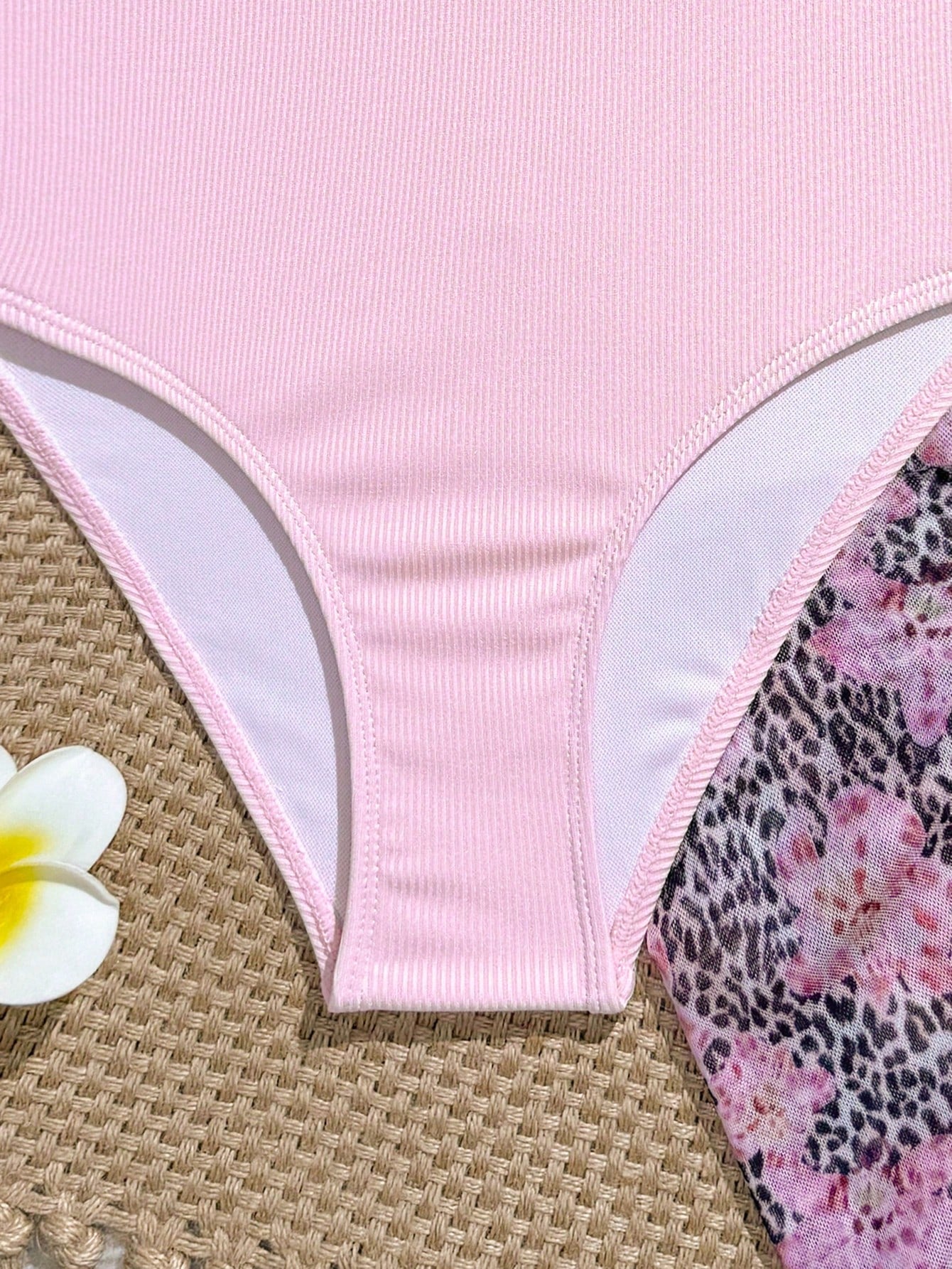 Blue girls one-piece swimsuit with spaghetti straps, textured plain fabric, shell-inspired detail, and matching skirt bottom for beach or pool vacation wear.