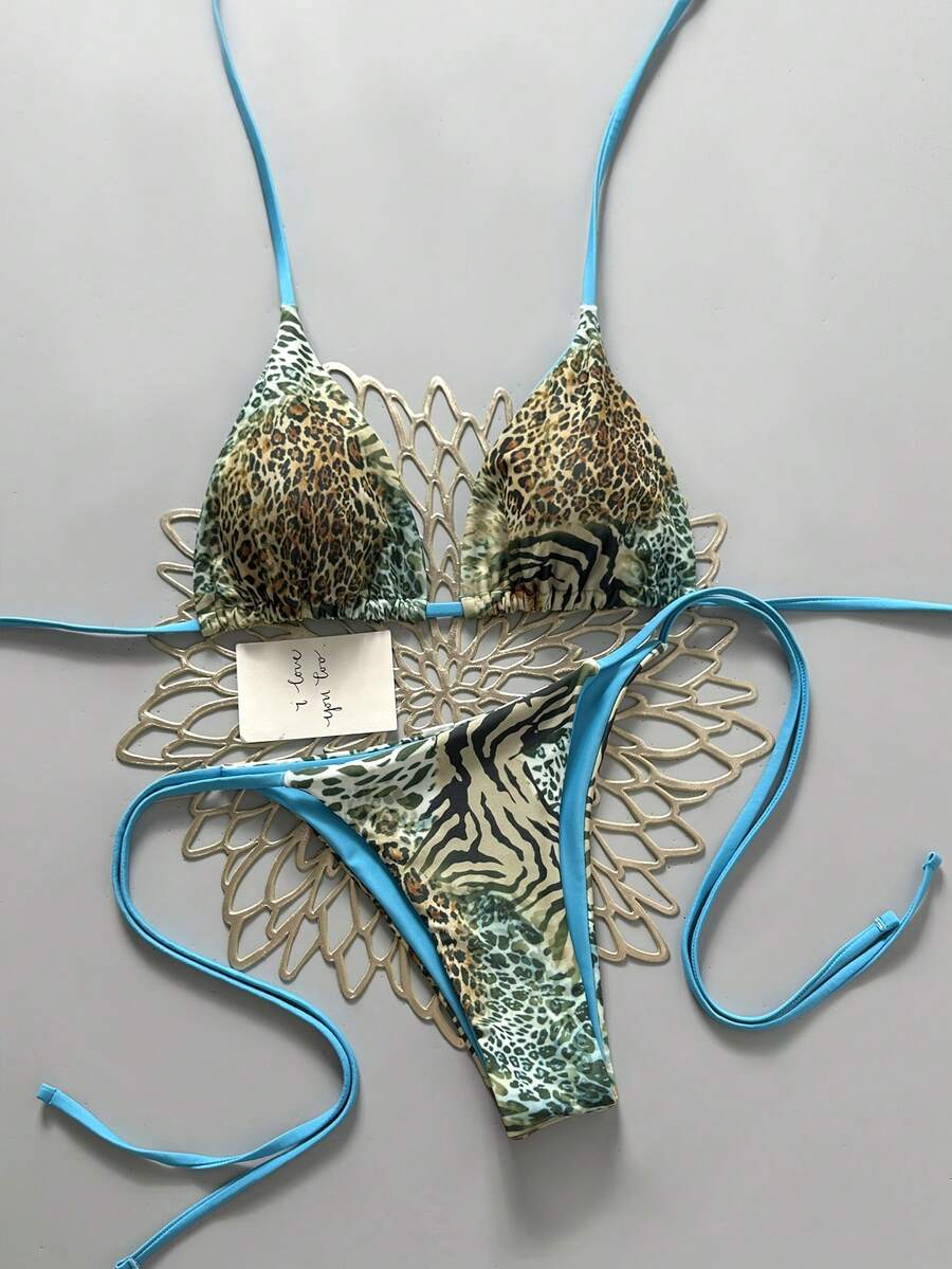 Women's vintage leopard print 2-piece bikini set featuring a high waist tie-side bottom and a halter neck triangle top.