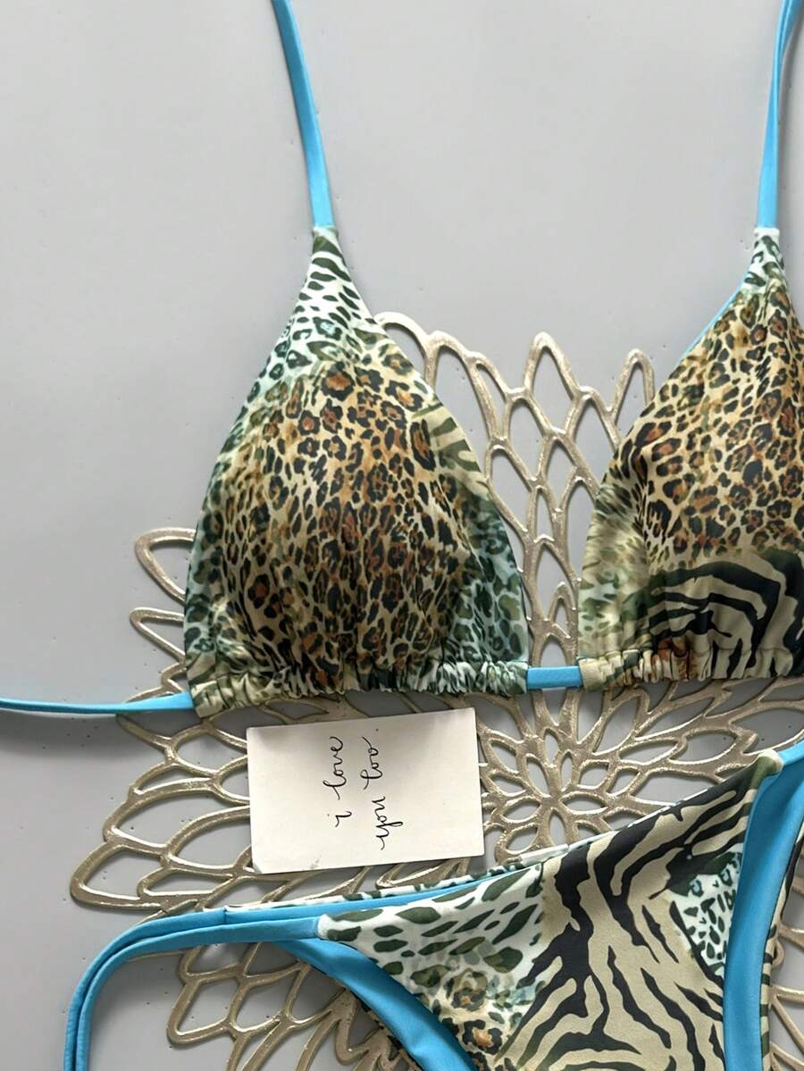 Women's vintage leopard print 2-piece bikini set featuring a high waist tie-side bottom and a halter neck triangle top.