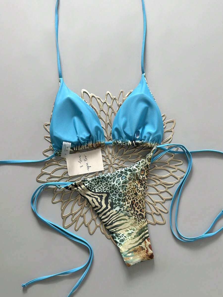 Women's vintage leopard print 2-piece bikini set featuring a high waist tie-side bottom and a halter neck triangle top.