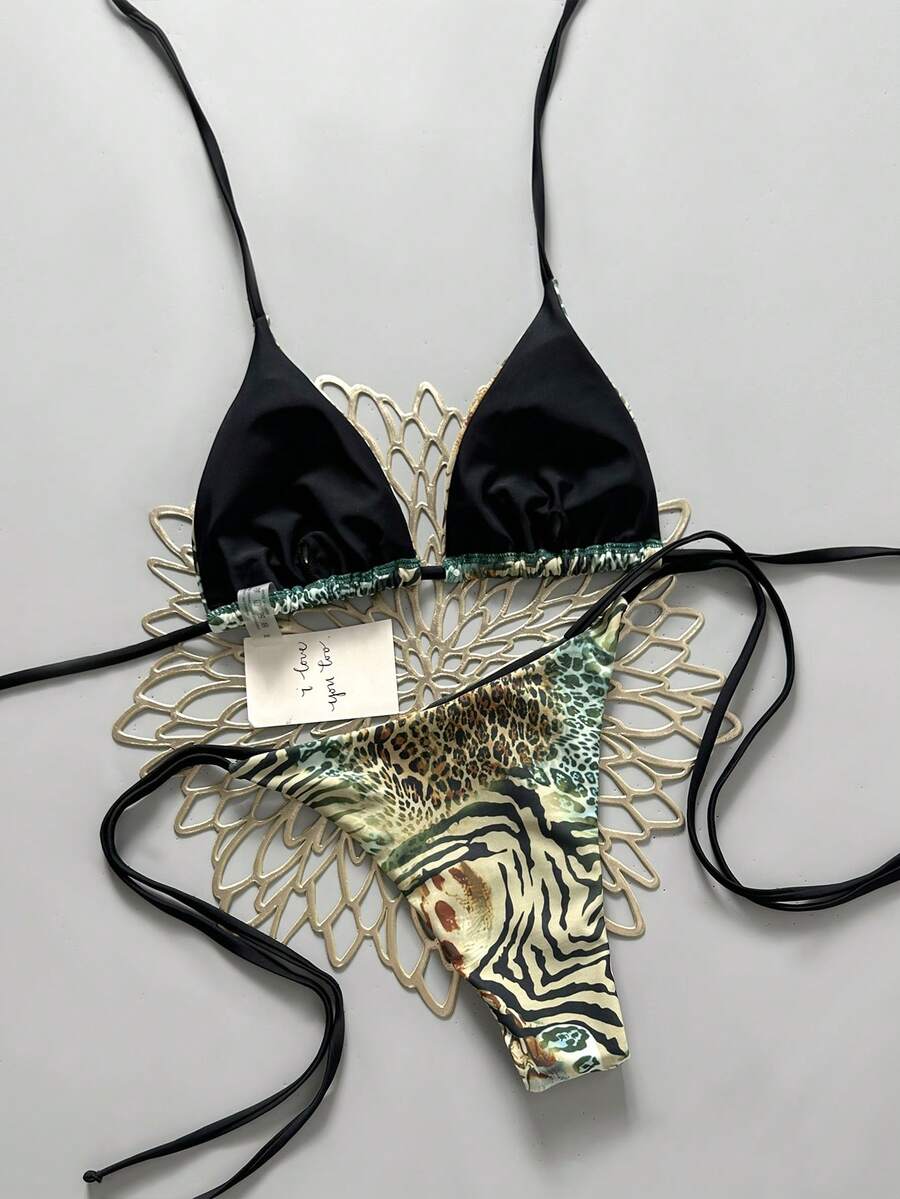 Women's vintage leopard print 2-piece bikini set featuring a high waist tie-side bottom and a halter neck triangle top.