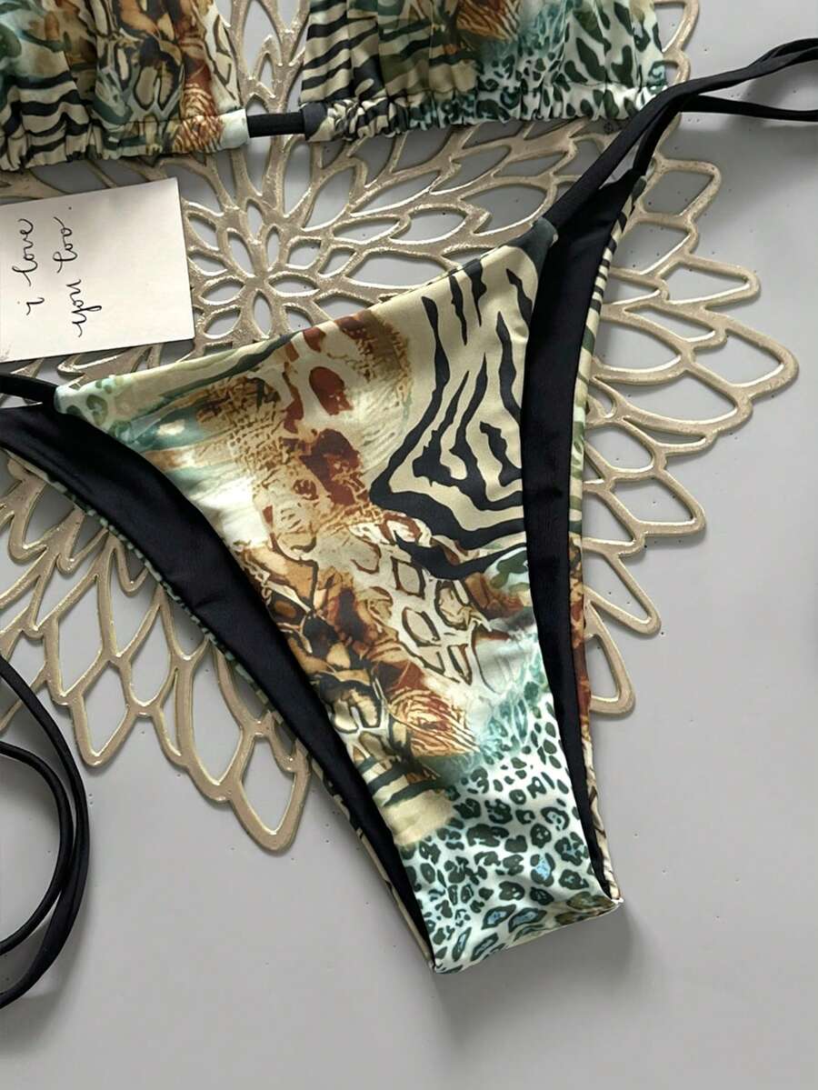 Women's vintage leopard print 2-piece bikini set featuring a high waist tie-side bottom and a halter neck triangle top.