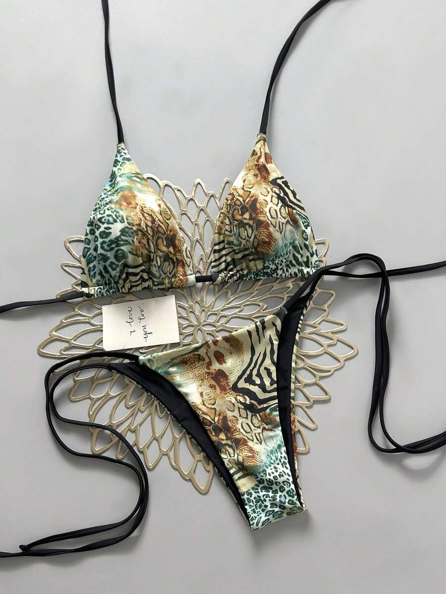 Women's vintage leopard print 2-piece bikini set featuring a high waist tie-side bottom and a halter neck triangle top.