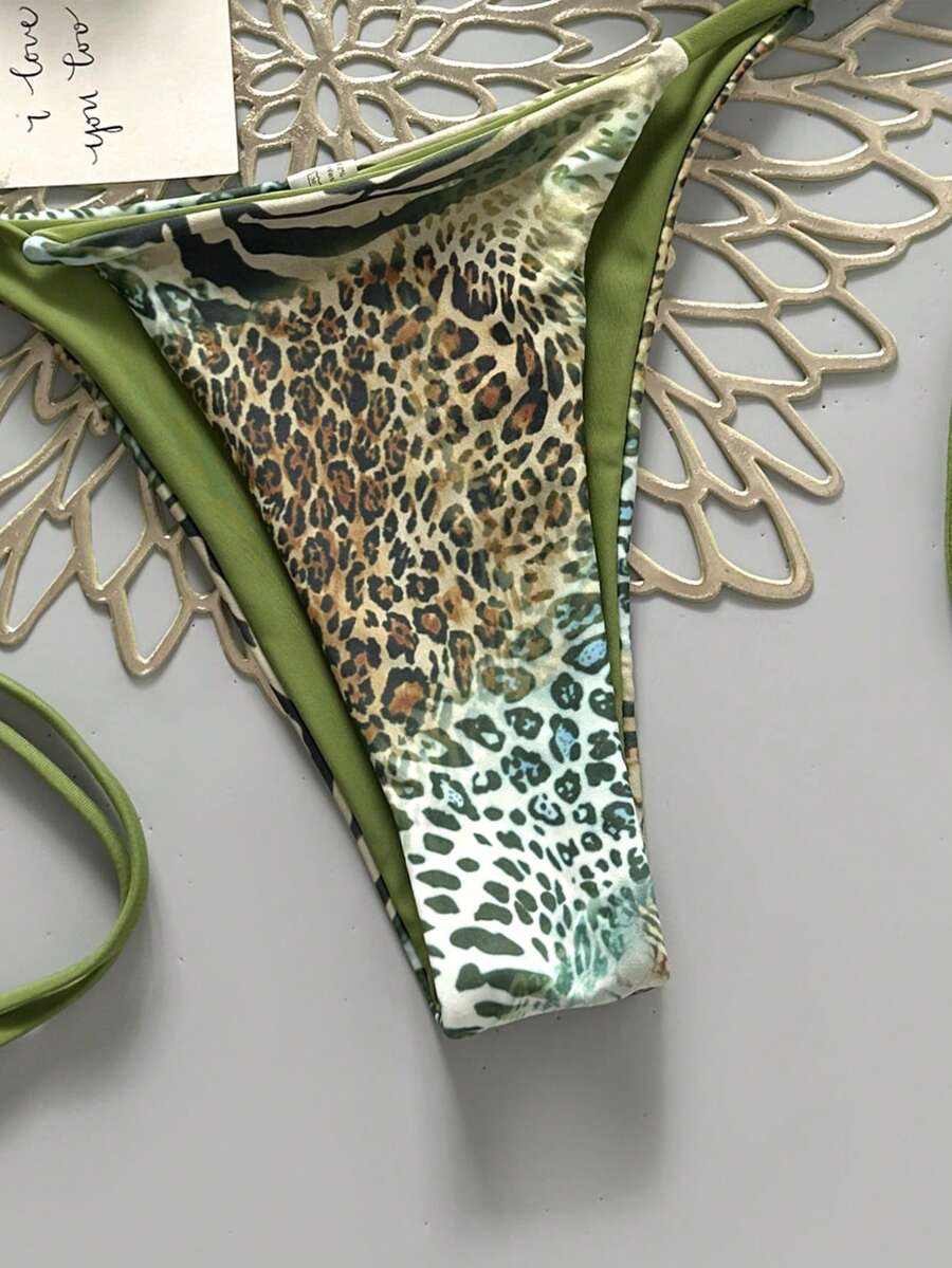 Women's vintage leopard print 2-piece bikini set featuring a high waist tie-side bottom and a halter neck triangle top.
