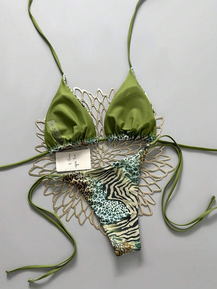 Women's vintage leopard print 2-piece bikini set featuring a high waist tie-side bottom and a halter neck triangle top.