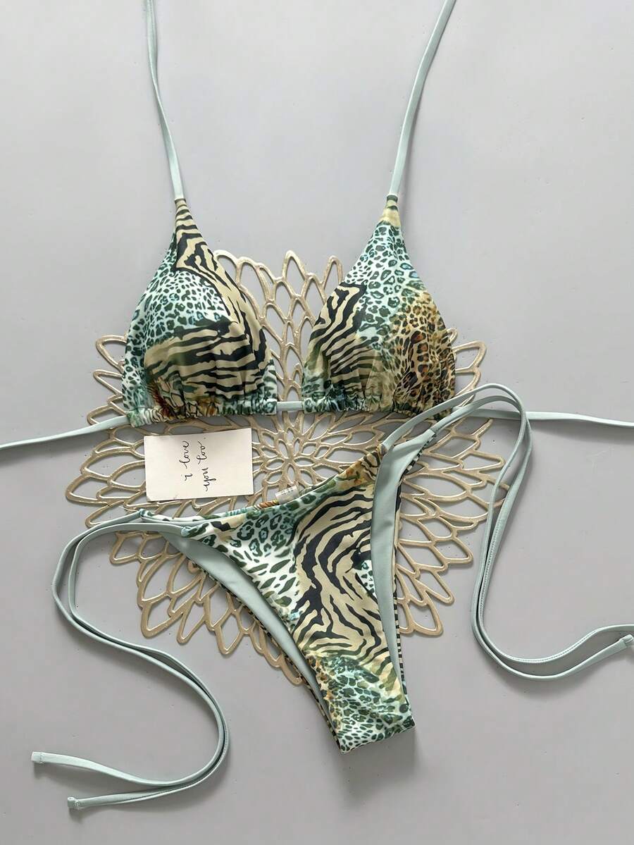 Women's vintage leopard print 2-piece bikini set featuring a high waist tie-side bottom and a halter neck triangle top.