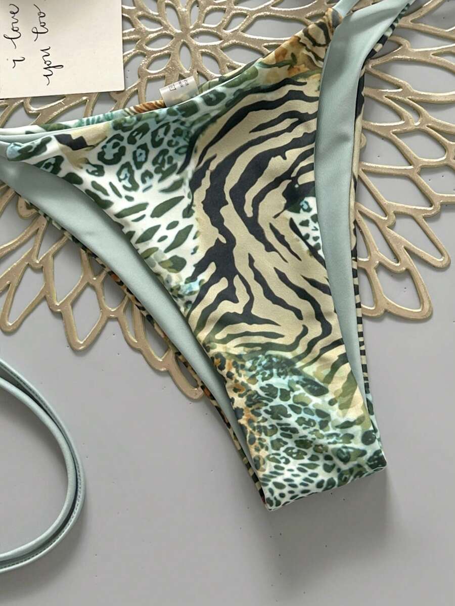 Women's vintage leopard print 2-piece bikini set featuring a high waist tie-side bottom and a halter neck triangle top.
