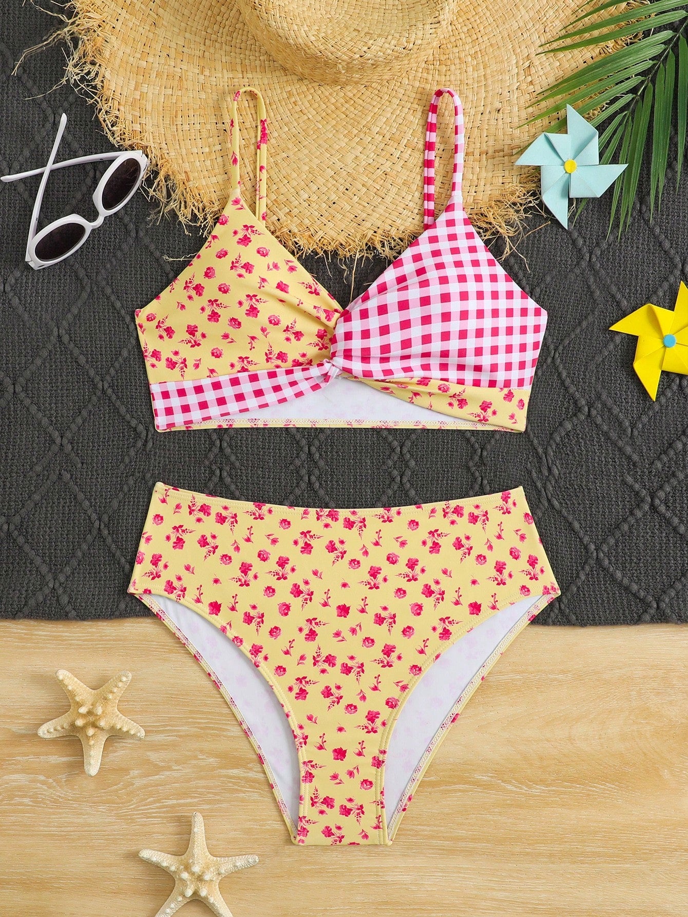 Tween girls 2-piece ditsy floral bikini set featuring a spaghetti strap top with center string detail and matching bottoms with side strings, designed for swimming, vacation, and summer wear.