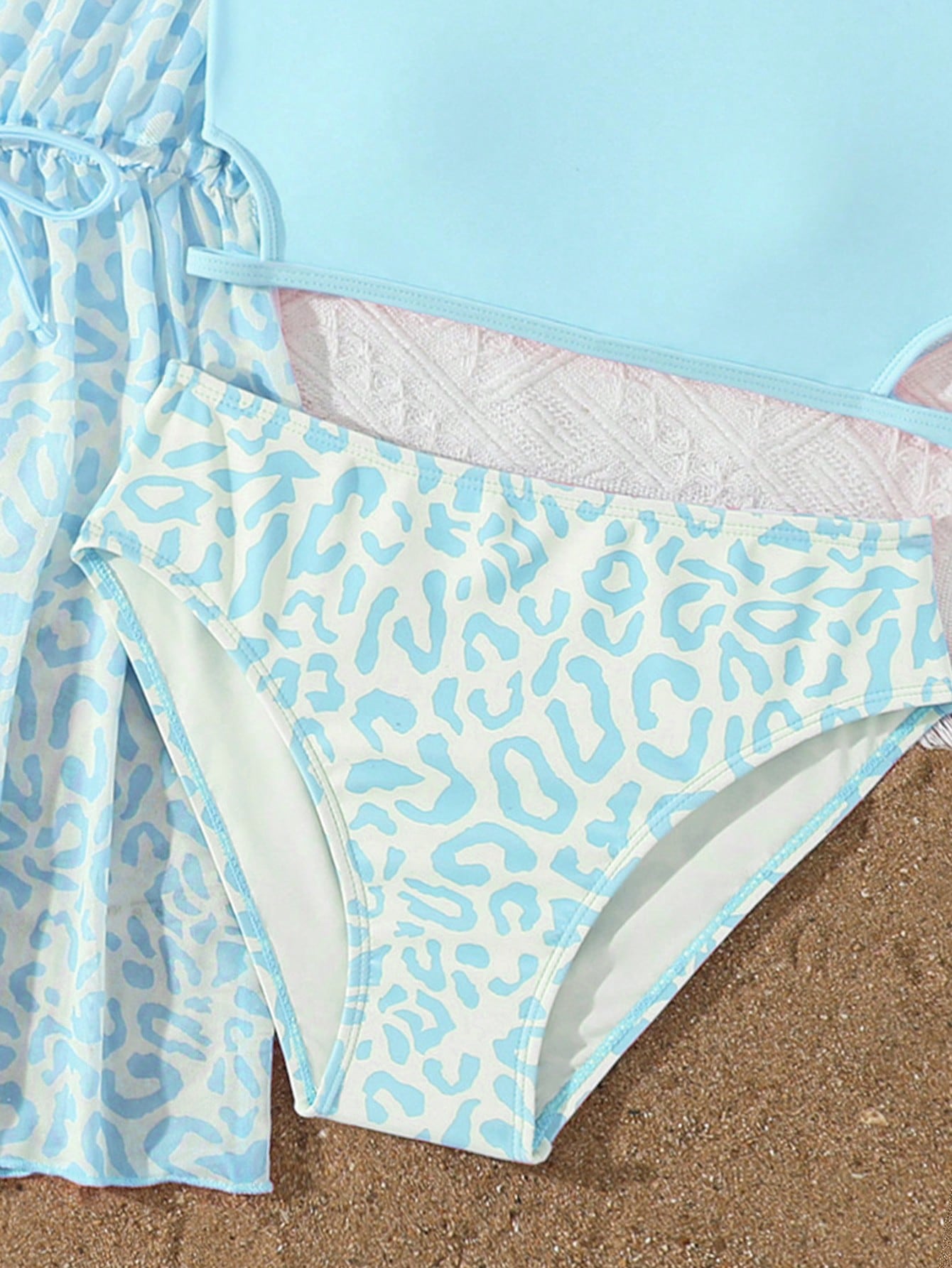 Tween girls 3-piece striped swimwear set featuring a tankini top, mid-waist bikini bottoms with a drawstring waist, and a matching kimono cover-up for beach or vacation wear.