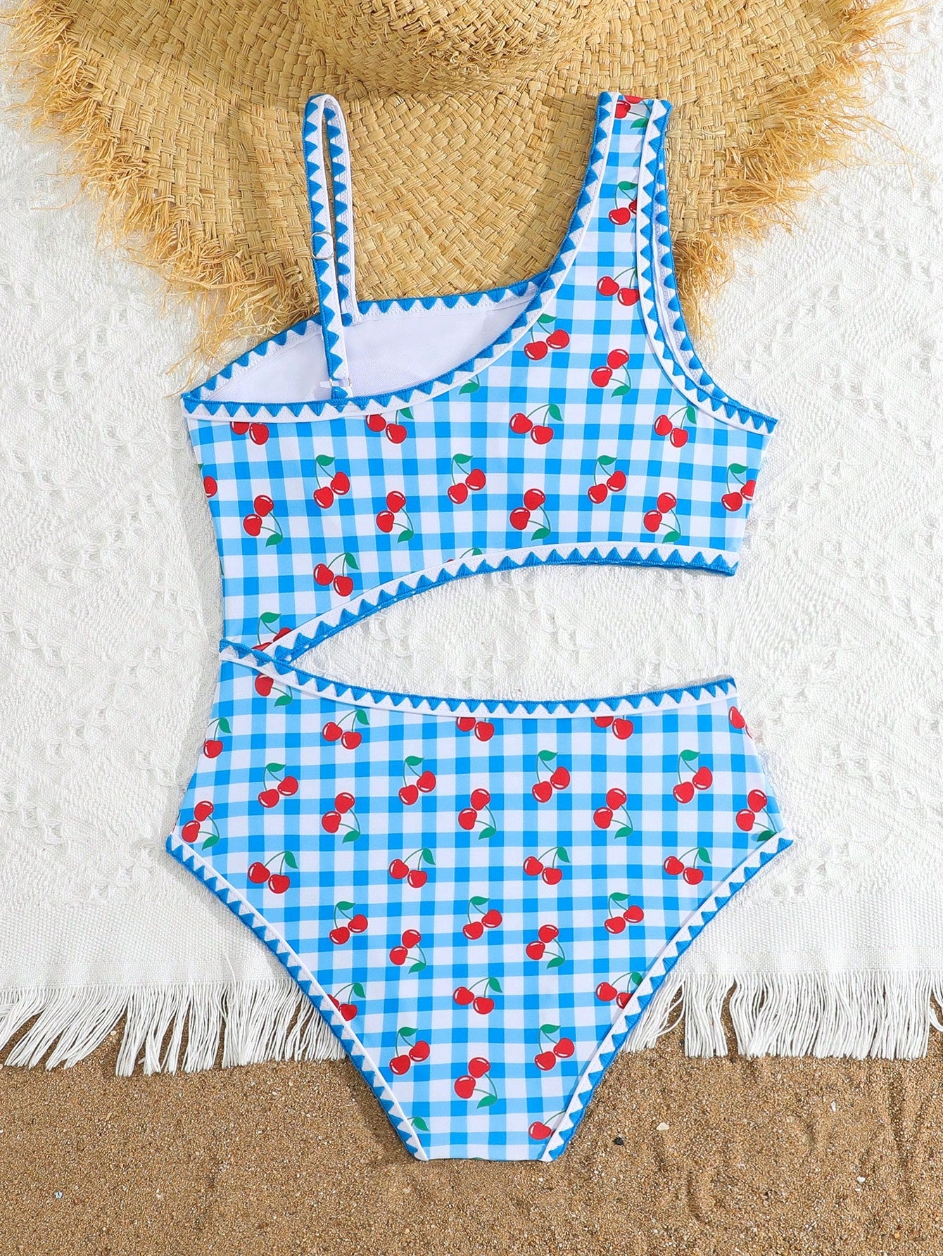 Tween girls one-piece swimsuit featuring an asymmetric neckline, pendant decor, plain design, wireless bra, high-cut bottom, and medium-stretch fabric.