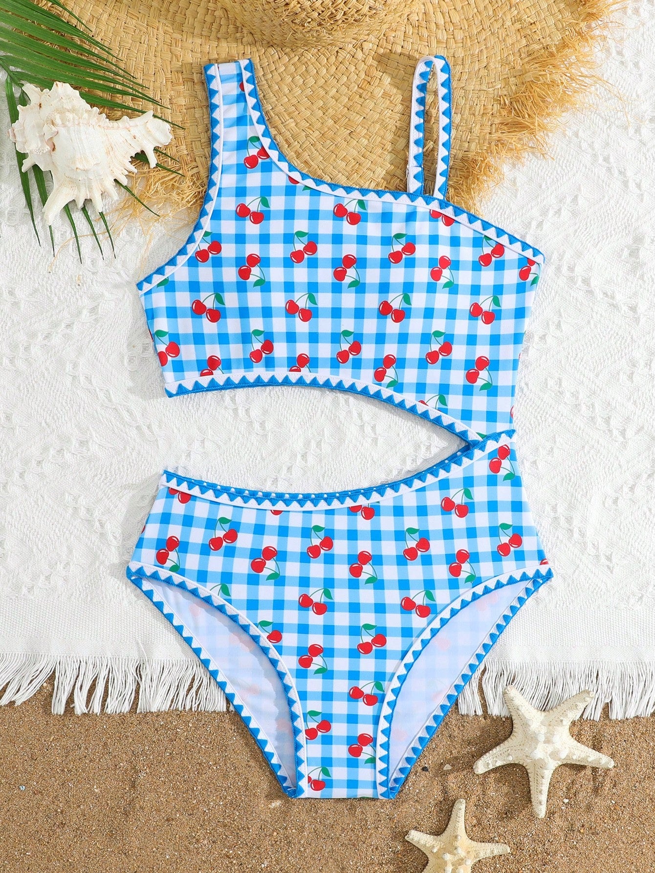 Tween girls one-piece swimsuit featuring an asymmetric neckline, pendant decor, plain design, wireless bra, high-cut bottom, and medium-stretch fabric.