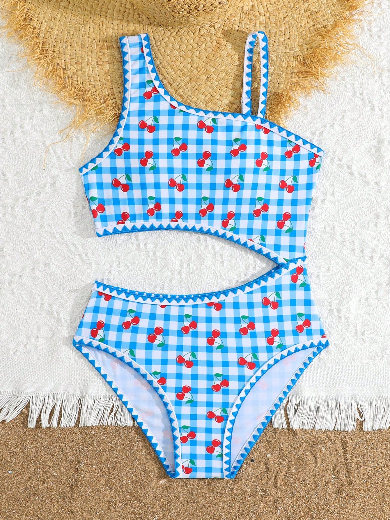 Tween girls one-piece swimsuit featuring an asymmetric neckline, pendant decor, plain design, wireless bra, high-cut bottom, and medium-stretch fabric.