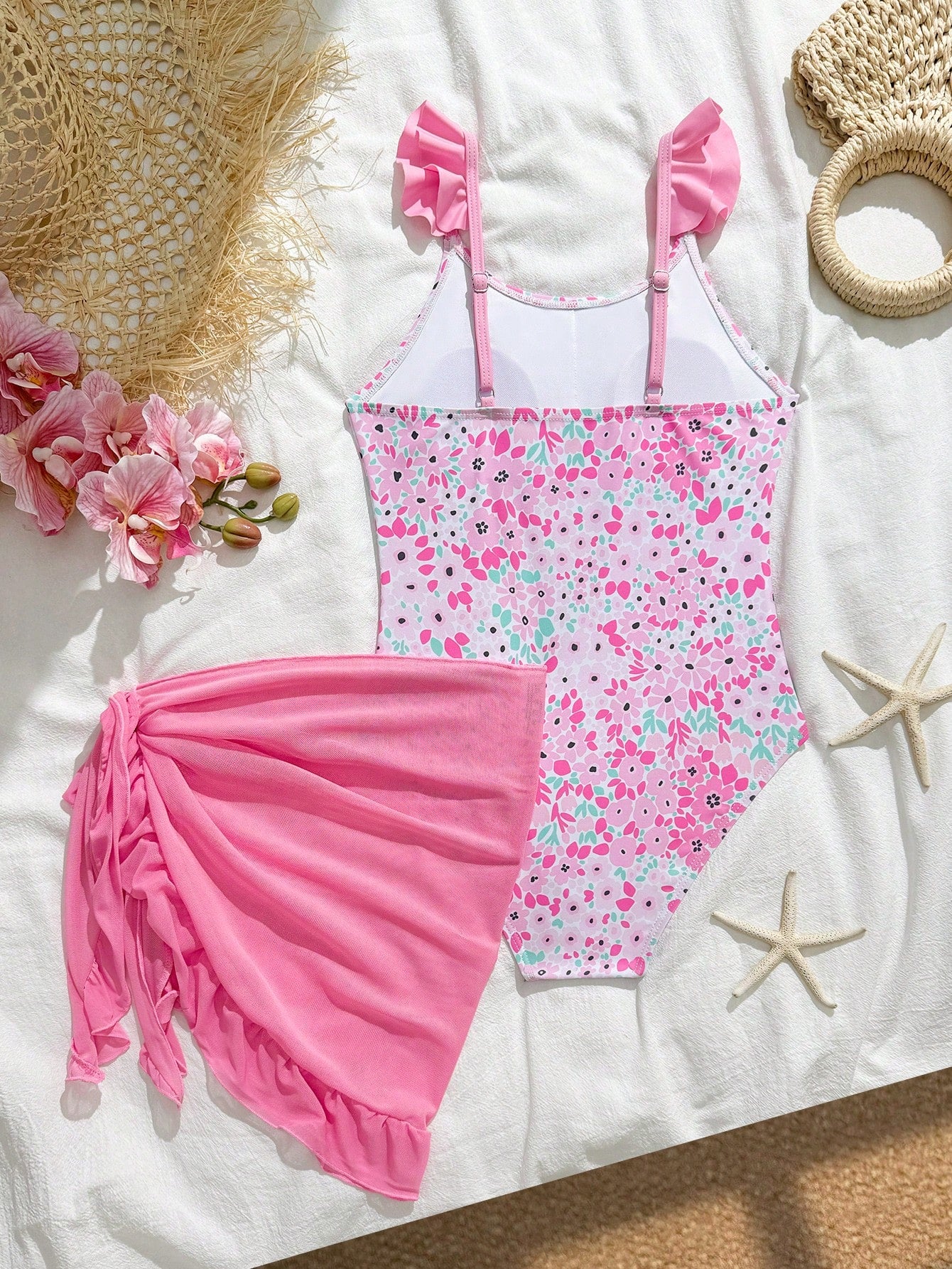 Tween girls one-piece swimsuit in leopard print with ruffle shoulder straps, scoop neckline, fitted shape, and attached ruffle hem skirt; sleeveless, mid-waist skirt bottom, and lined body for swimming, vacation, and summer beach wear.