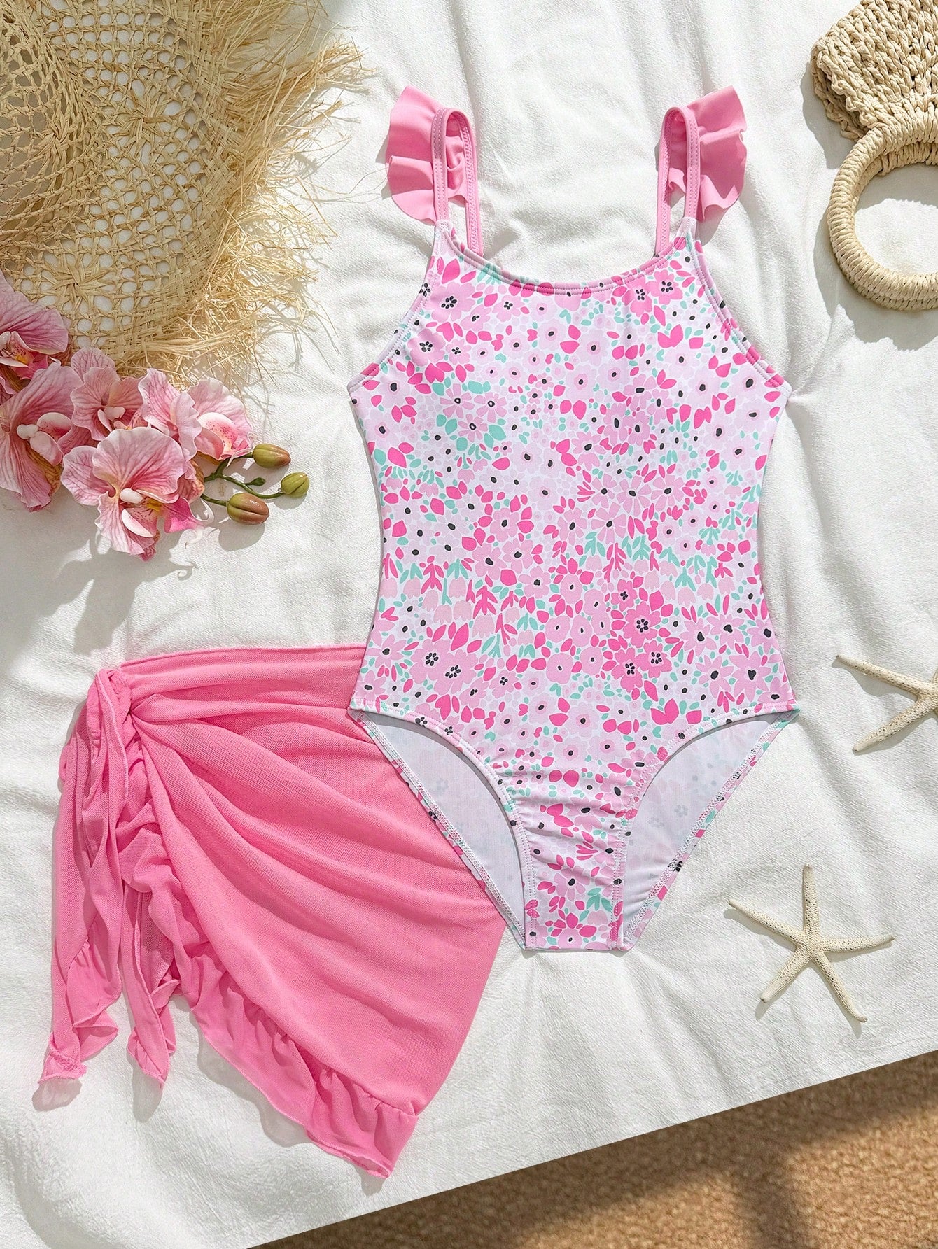 Tween girls one-piece swimsuit in leopard print with ruffle shoulder straps, scoop neckline, fitted shape, and attached ruffle hem skirt; sleeveless, mid-waist skirt bottom, and lined body for swimming, vacation, and summer beach wear.