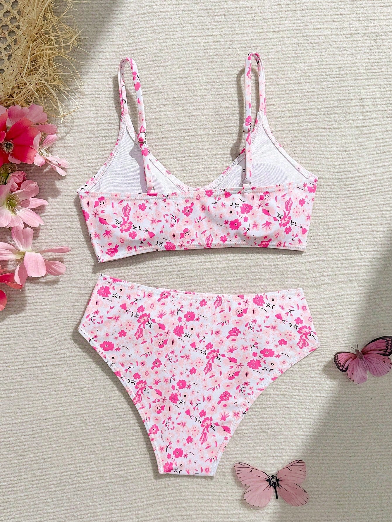 Tween girls 2-piece ditsy floral bikini set featuring a spaghetti strap top with center string detail and matching bottoms with side strings, designed for swimming, vacation, and summer wear.