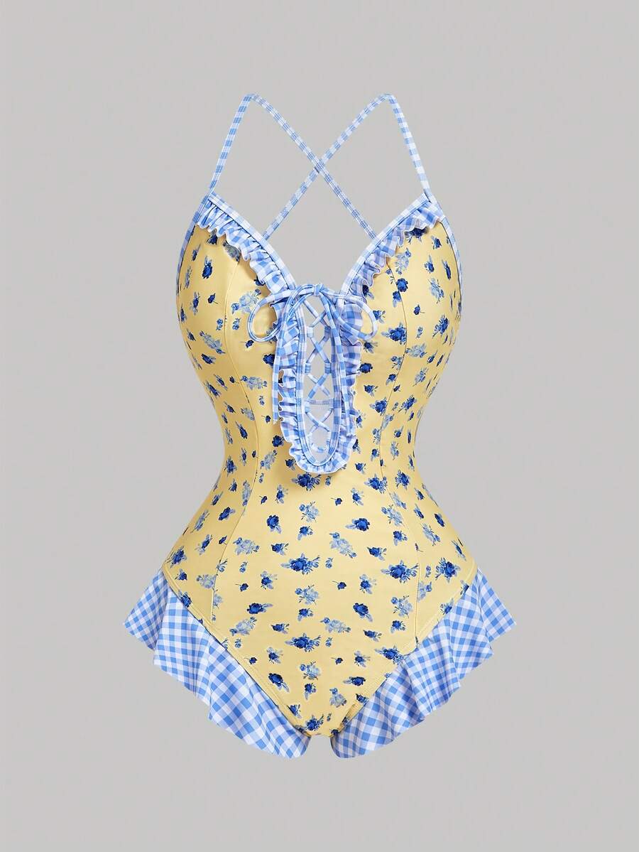 Women's strawberry print one-piece swimsuit featuring ruffle details, front-tie design, backless criss-cross straps, and triangle wireless cups.