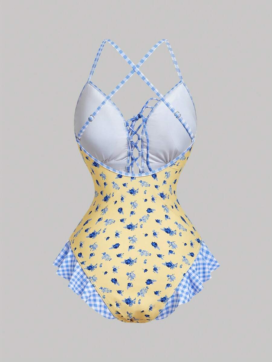 Women's strawberry print one-piece swimsuit featuring ruffle details, front-tie design, backless criss-cross straps, and triangle wireless cups.