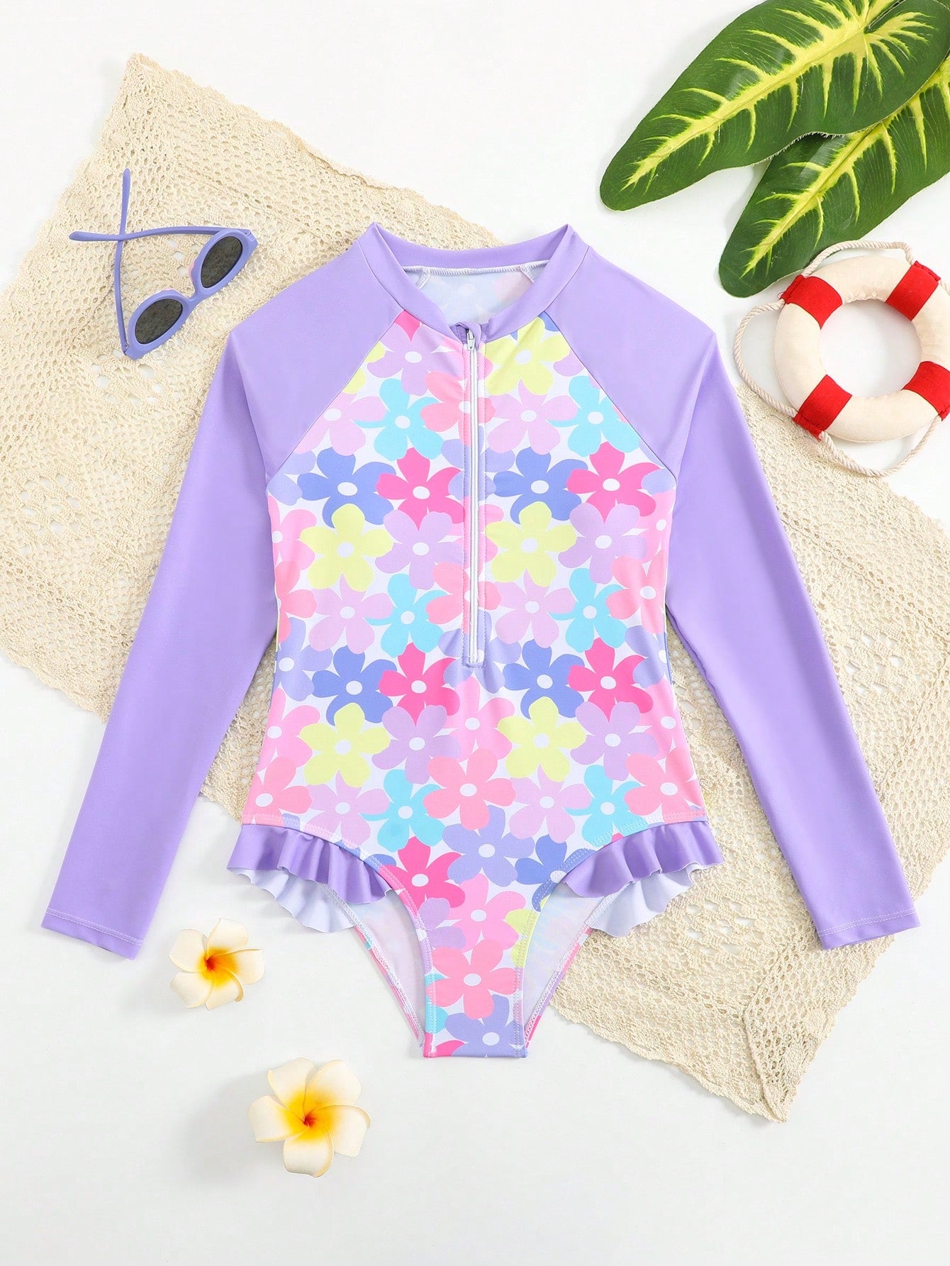 Girls' floral one-piece swimsuit with ruffle trim, high neck, and zipper front for beach and resort wear
