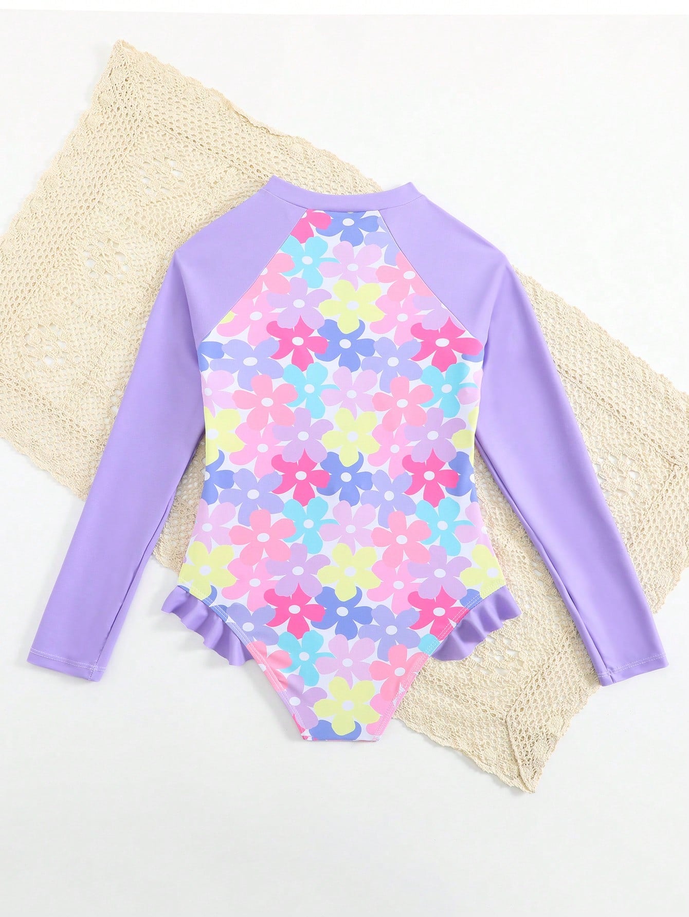 Girls' floral one-piece swimsuit with ruffle trim, high neck, and zipper front for beach and resort wear