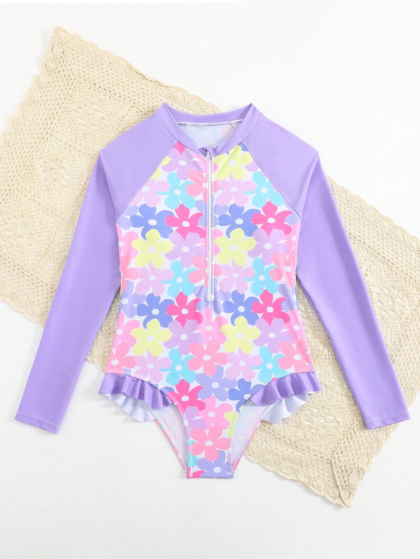 Girls' floral one-piece swimsuit with ruffle trim, high neck, and zipper front for beach and resort wear
