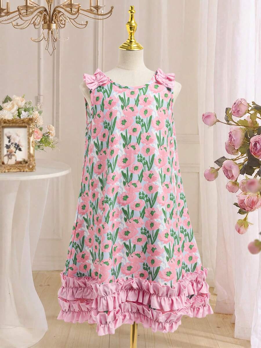 Tween girls sleeveless tropical floral mini dress in black with round neck and ruffle hem detail