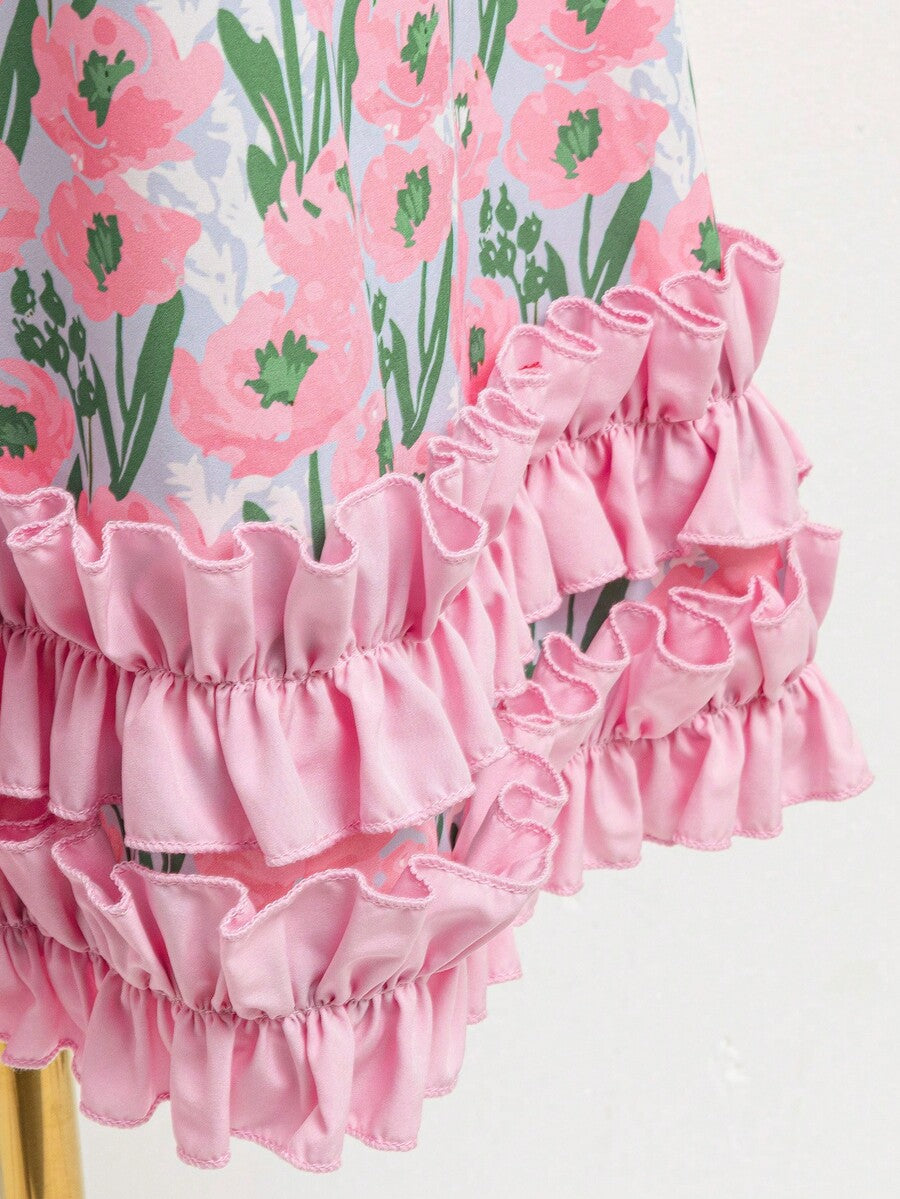 Tween girls sleeveless tropical floral mini dress in black with round neck and ruffle hem detail