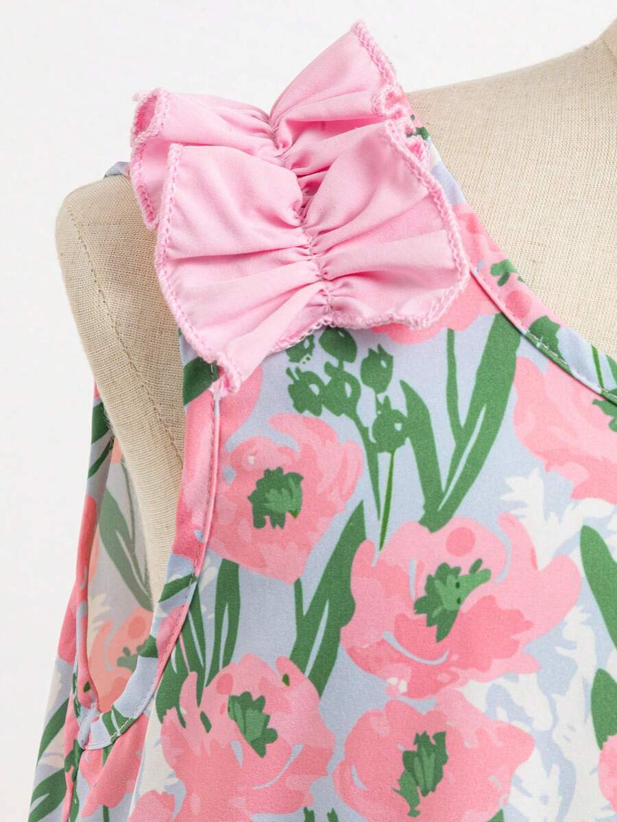 Tween girls sleeveless tropical floral mini dress in black with round neck and ruffle hem detail