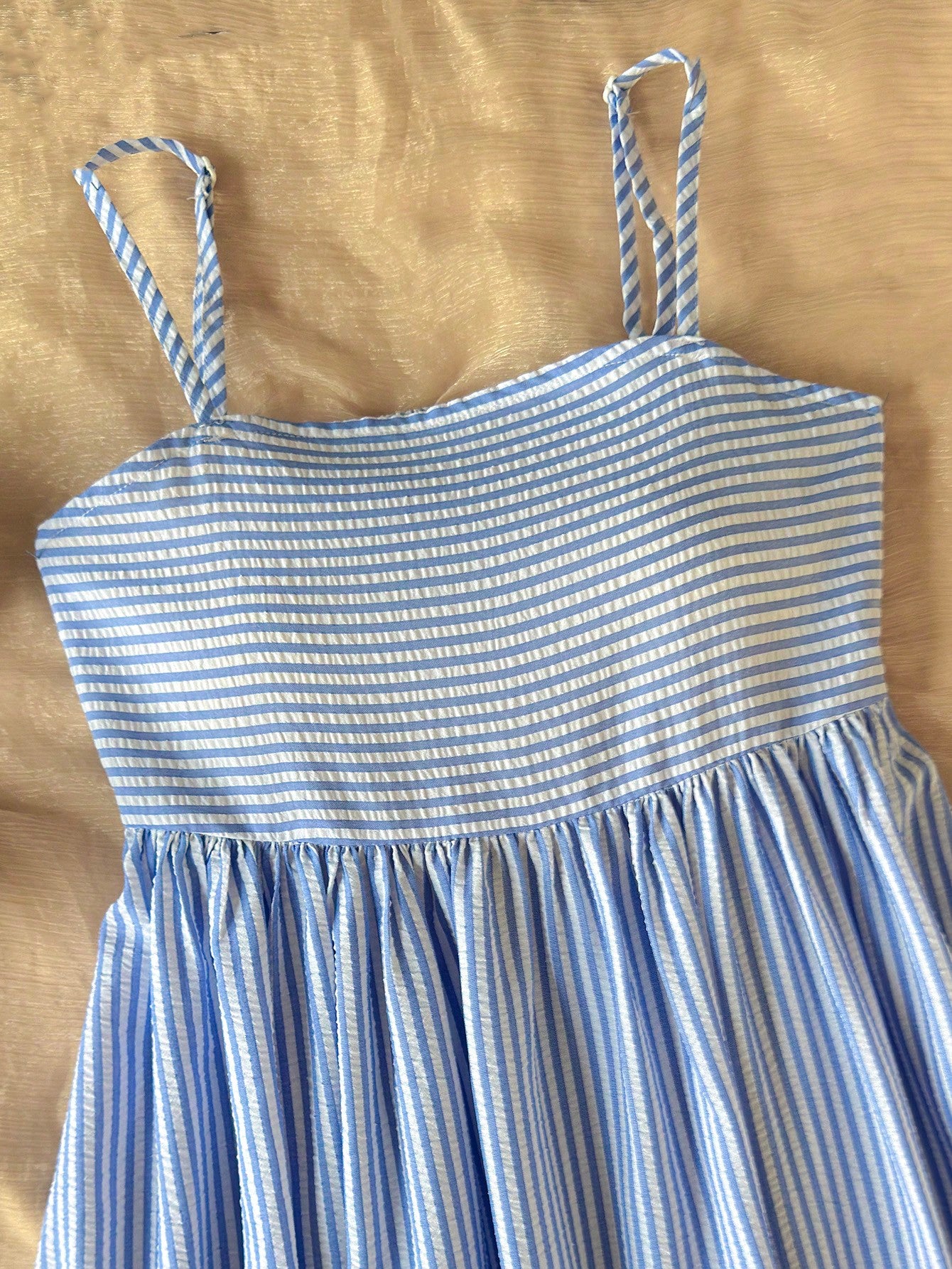 Tween girls striped spaghetti strap cami dress with high waist, shirred detail, zipper closure, sleeveless design, and flared long A-line silhouette for vacation wear.