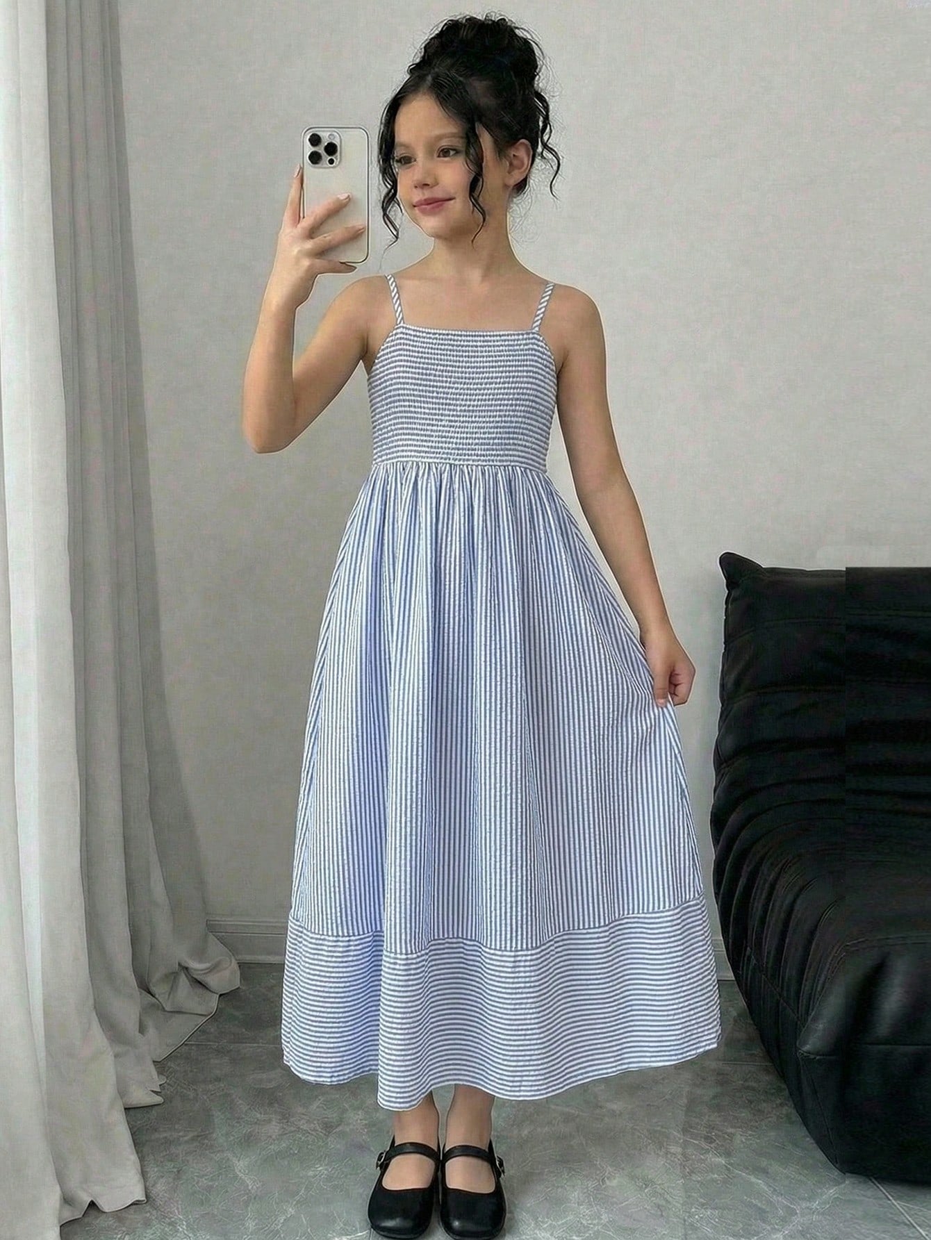 Tween girls striped spaghetti strap cami dress with high waist, shirred detail, zipper closure, sleeveless design, and flared long A-line silhouette for vacation wear.