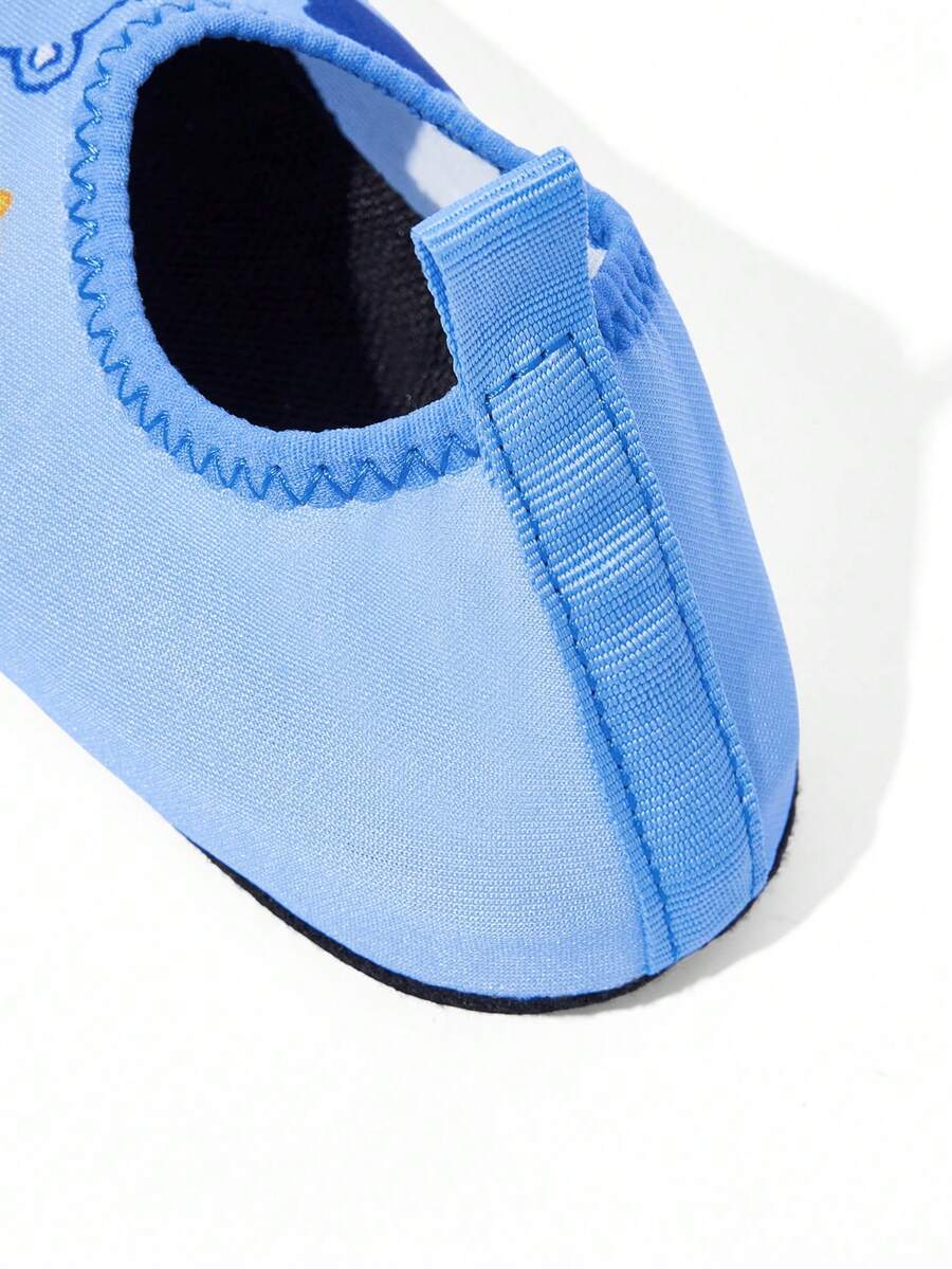 Girls cartoon pattern non-slip water shoes with slip-on closure and durable TPR outsole for beach and outdoor sports.