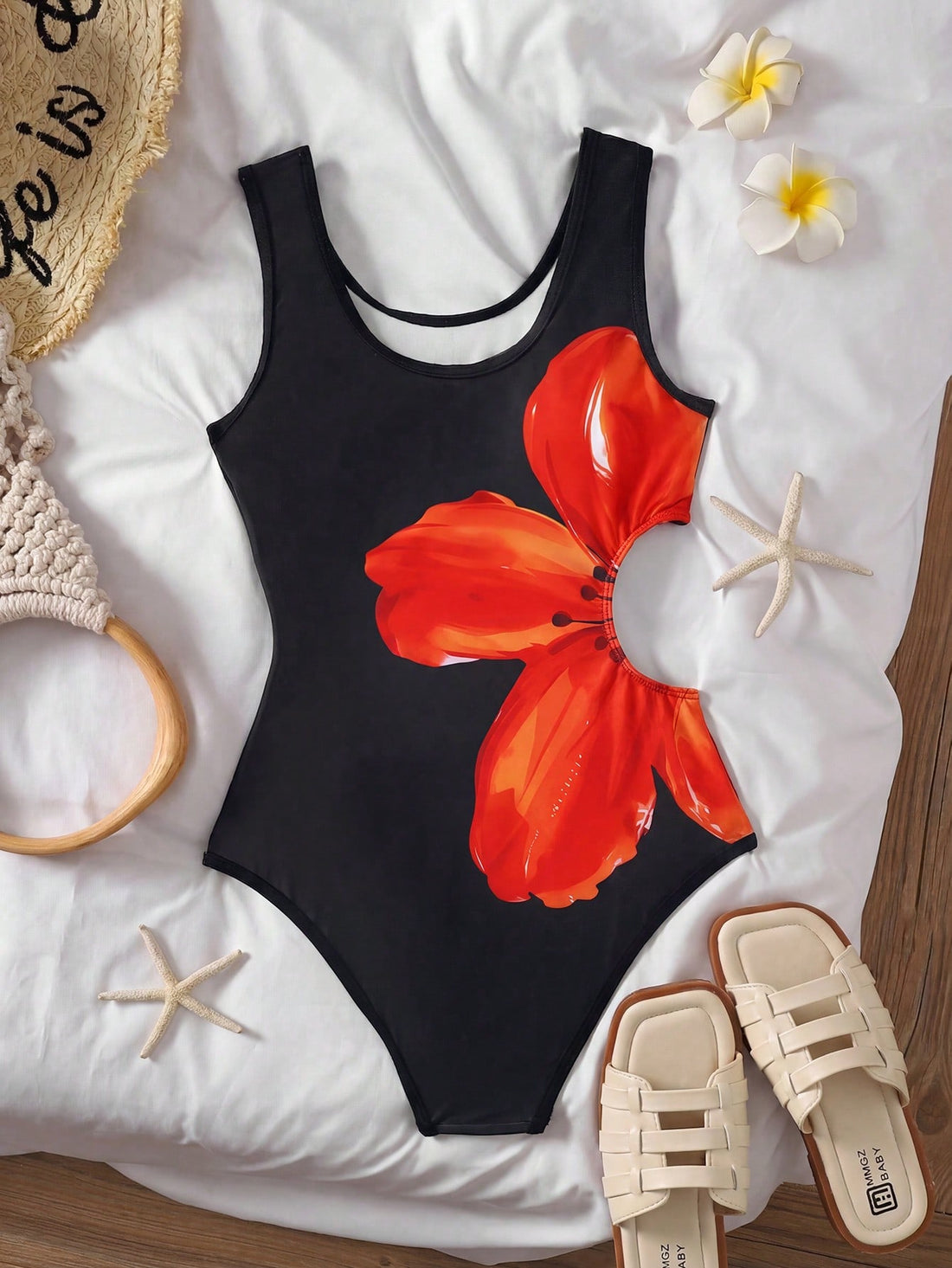 Tween girls' black and white one-piece swimsuit with striped patchwork design, scoop neck, asymmetrical cut-out detail, and fitted vacation swimwear style.