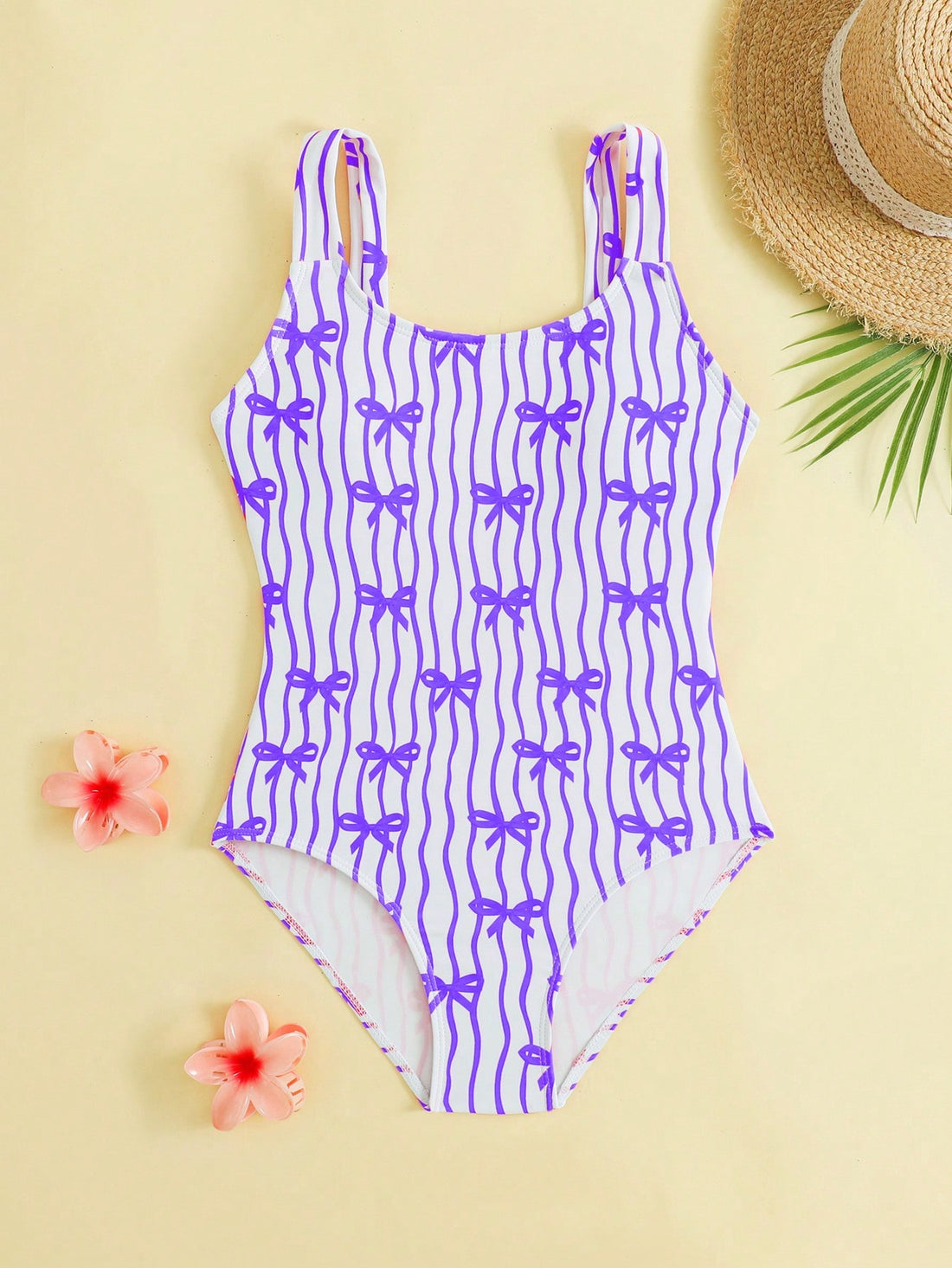 Tween girls one-piece swimsuit in mauve purple with all-over print, spaghetti straps, short length, and vacation swimwear style for beach, pool, and summer swimming.