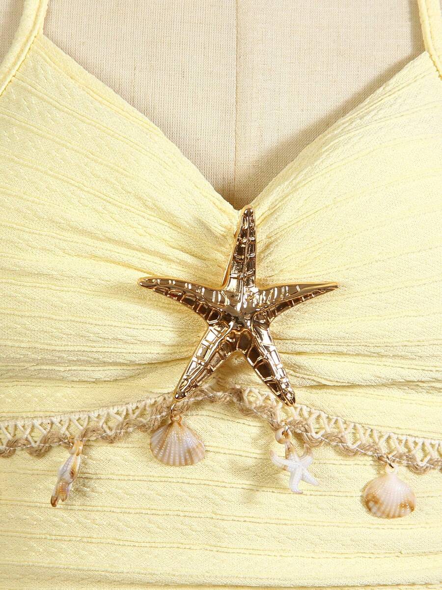 Tween girls apricot sleeveless halter mini dress with textured starfish and shell decor, shirred tiered layer, high waist, and flounce hem.