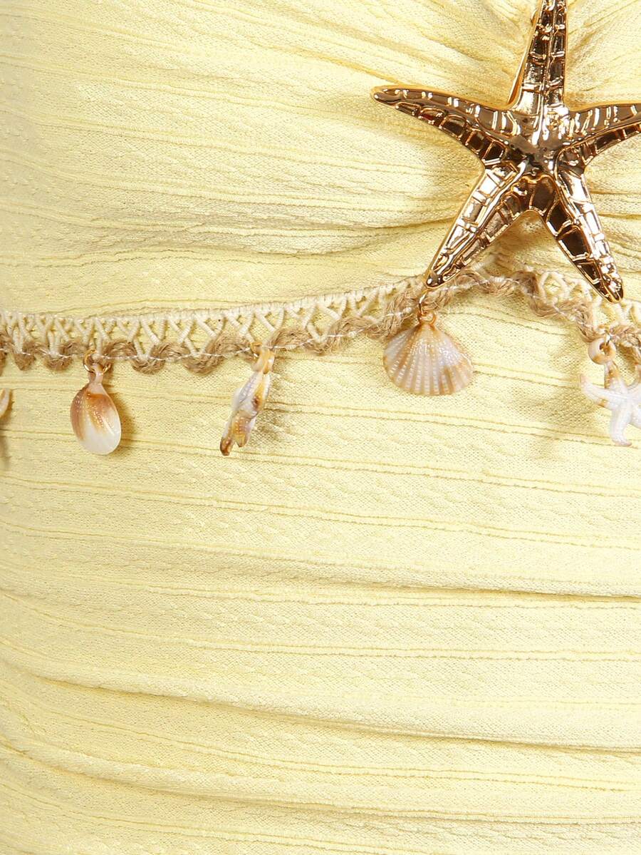 Tween girls apricot sleeveless halter mini dress with textured starfish and shell decor, shirred tiered layer, high waist, and flounce hem.
