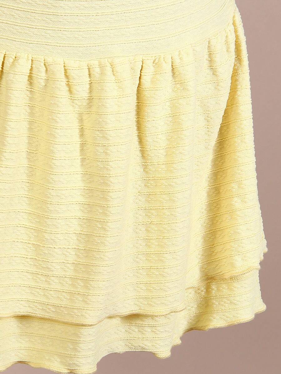 Tween girls apricot sleeveless halter mini dress with textured starfish and shell decor, shirred tiered layer, high waist, and flounce hem.